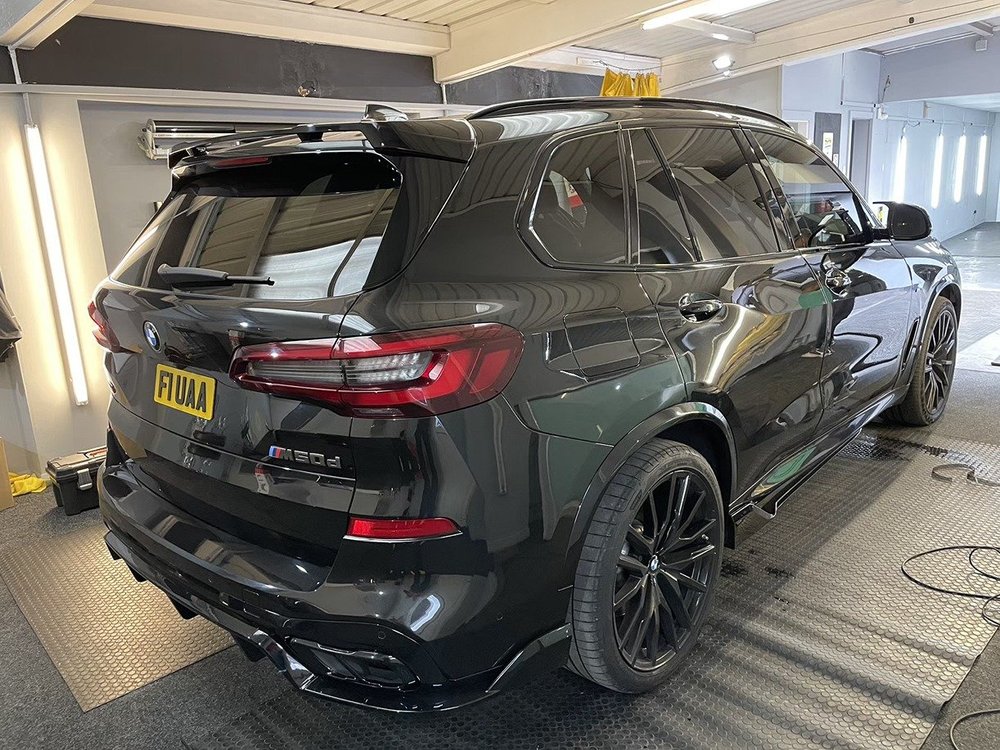 Black BMW SUV with tinted rear windows in the TintTech Nottingham studio