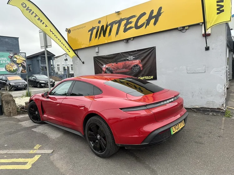 Red Porsche Taycan outside the TintTech Nottingham unit