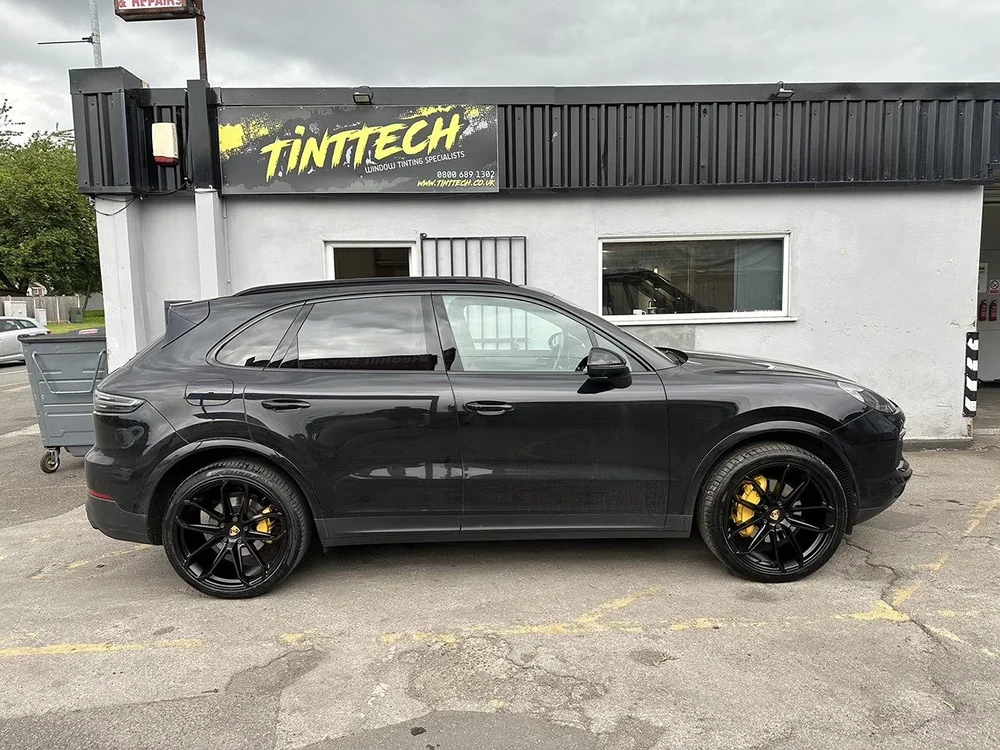 Black SUV with refurbished wheels and yellow painted calipers