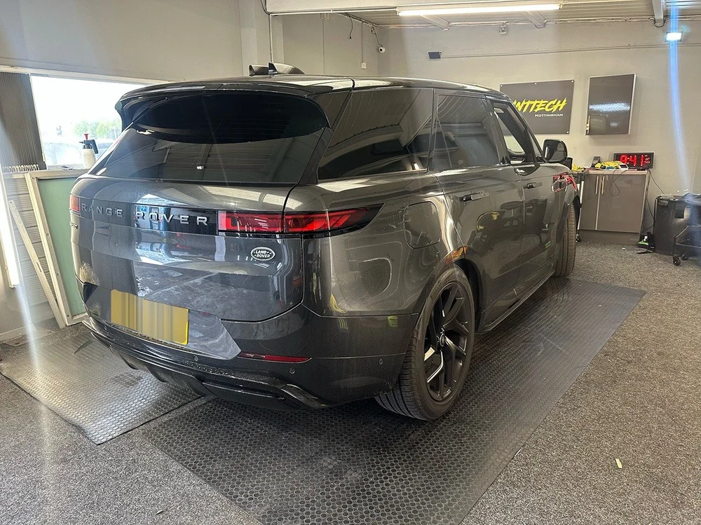 Black Range Rover with tinted lights in the TintTech Nottingham workshop