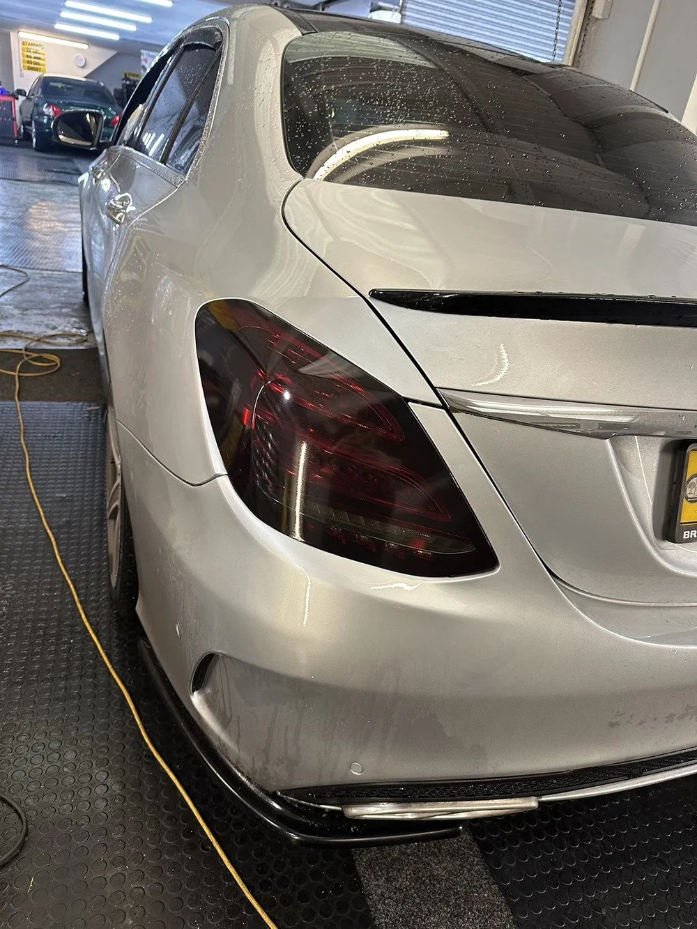 Rear of a silver car with freshly tinted tail lights at TintTech Nottingham