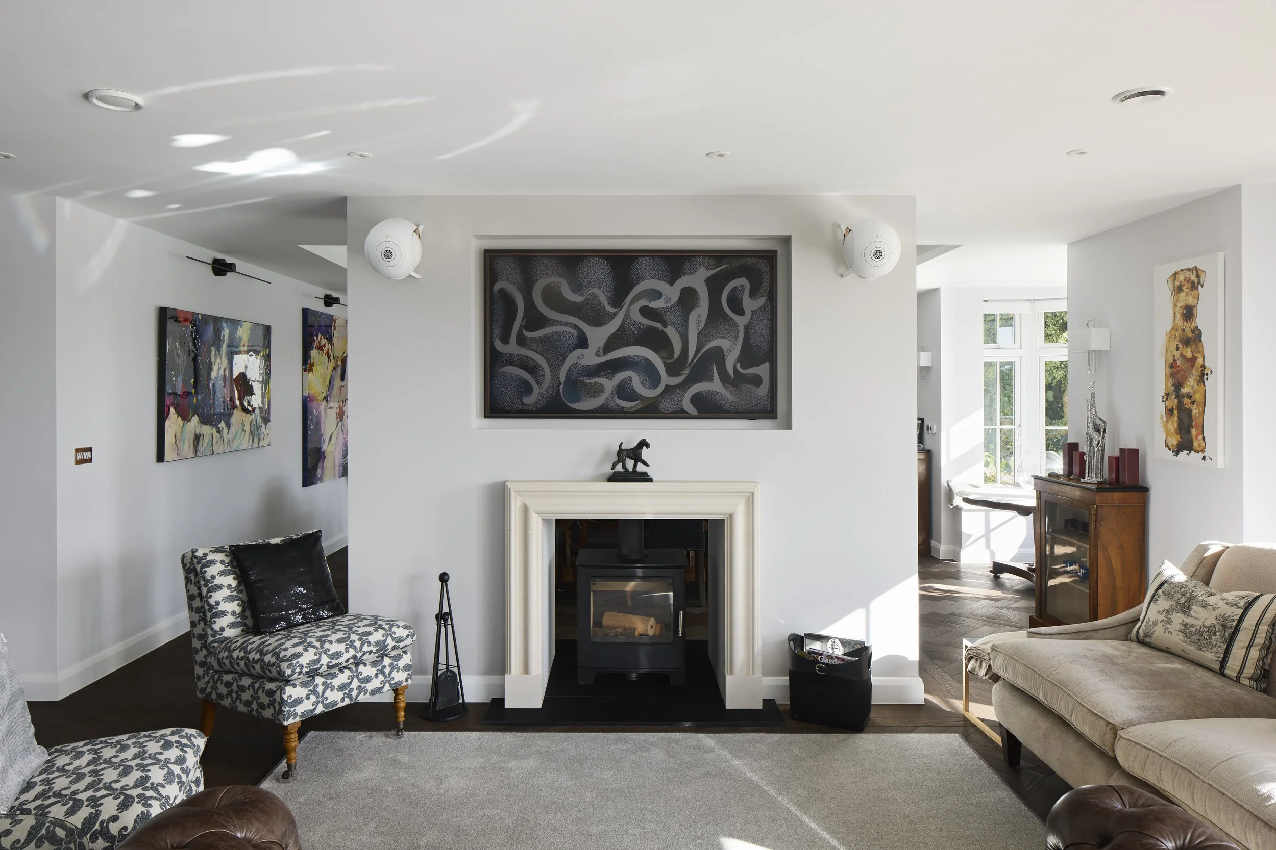 Living room at Over Links with fireplace, contemporary artwork and seating
