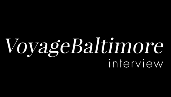 Black background with white text reading 'VoyageBaltimore interview' in a stylish font.