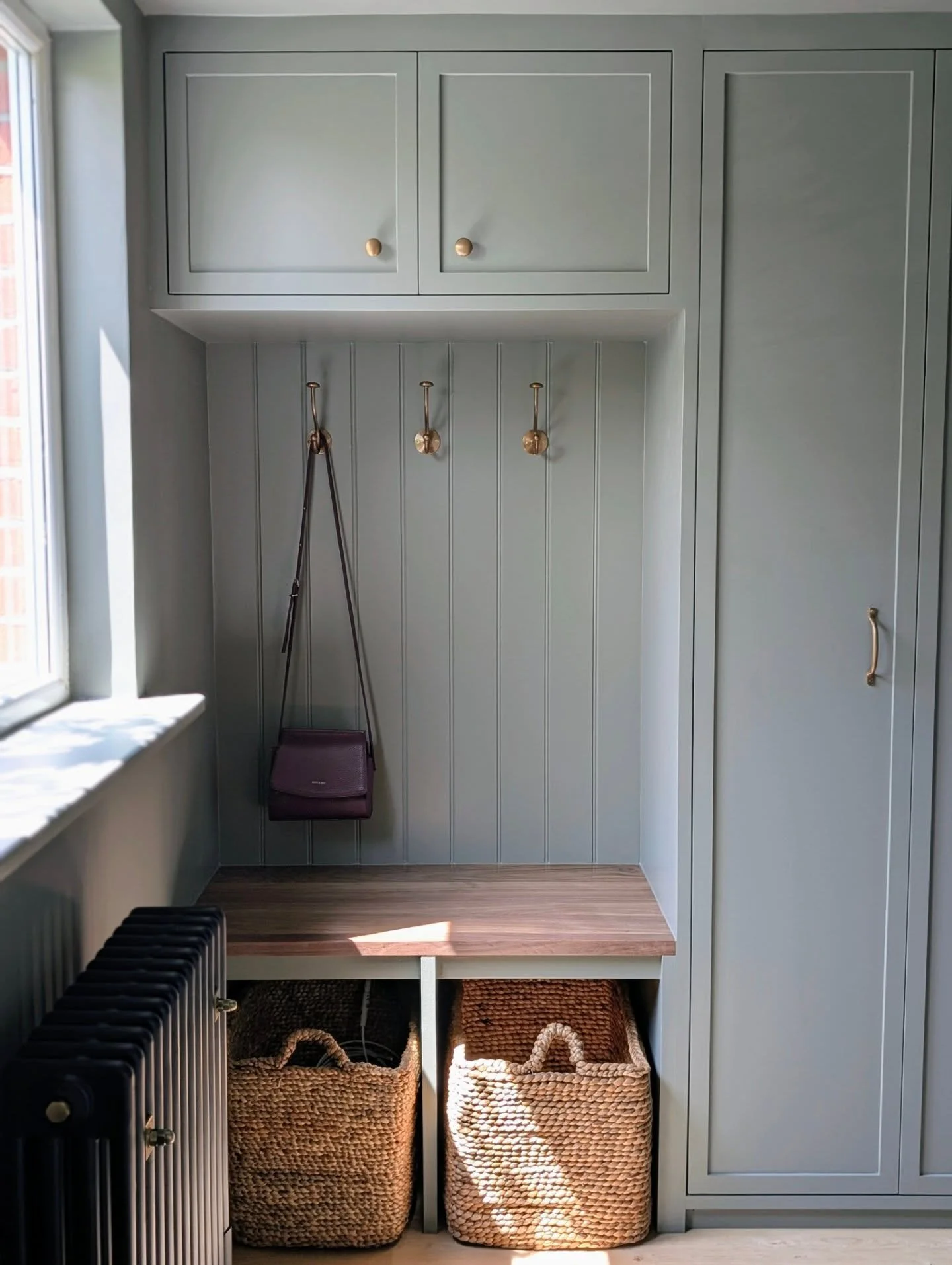 From former garage to a multifunctional dream space. What started as a bare space is now a beautifully designed boot room meets home office &mdash; the perfect blend of function and style.

This room came with its challenges: low ceilings and a compa