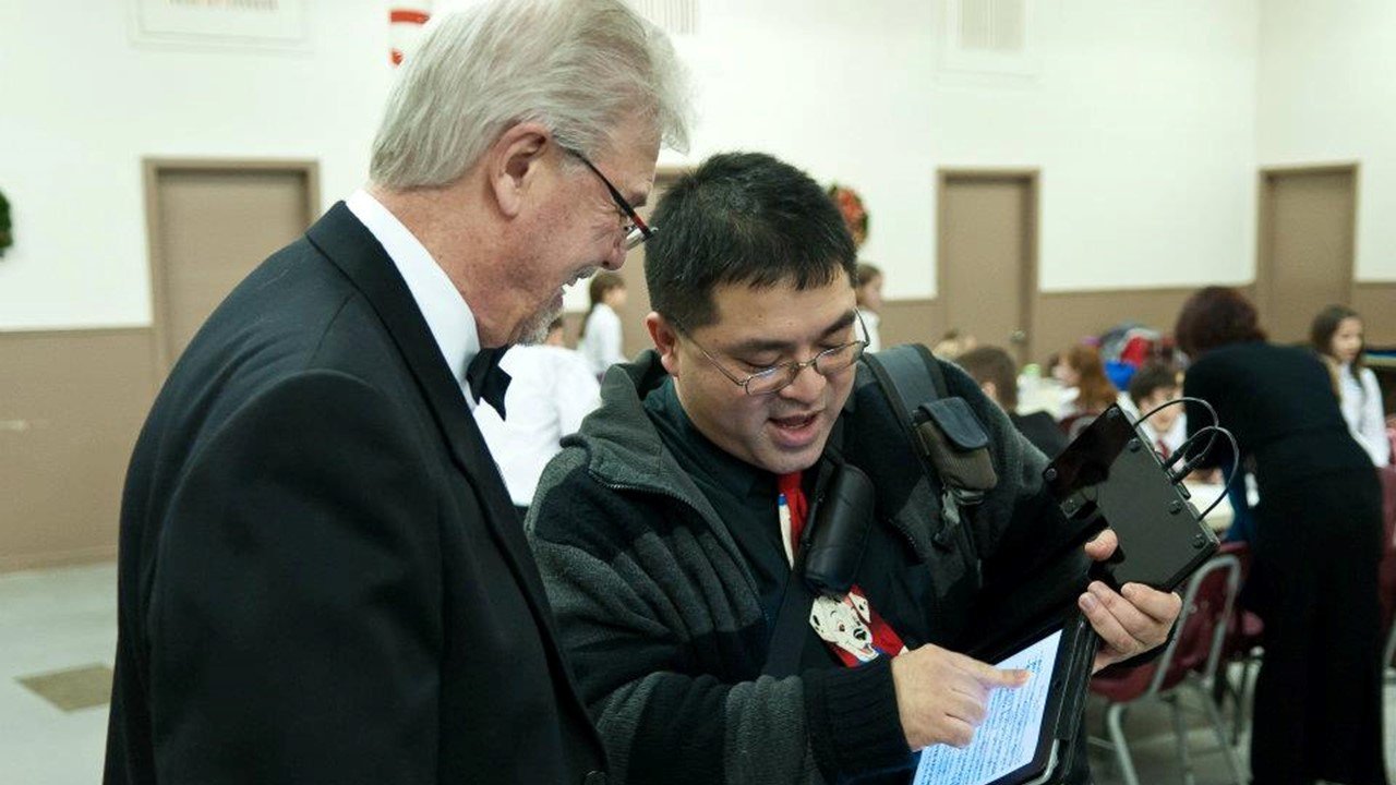 Toto showing iPad tech to Mike Day.jpg