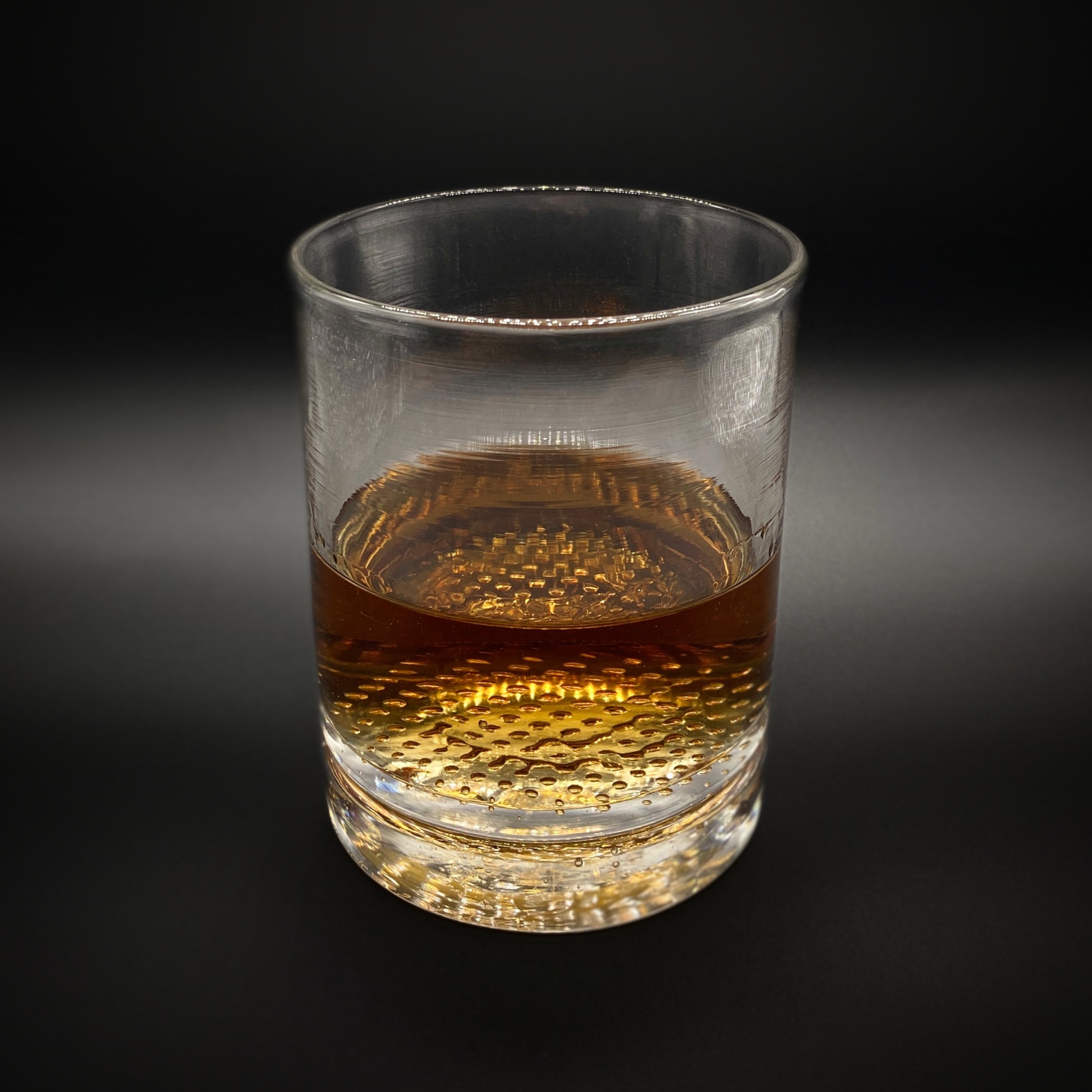 Whiskey+Tumbler+with+Rum+Black+Background.jpg