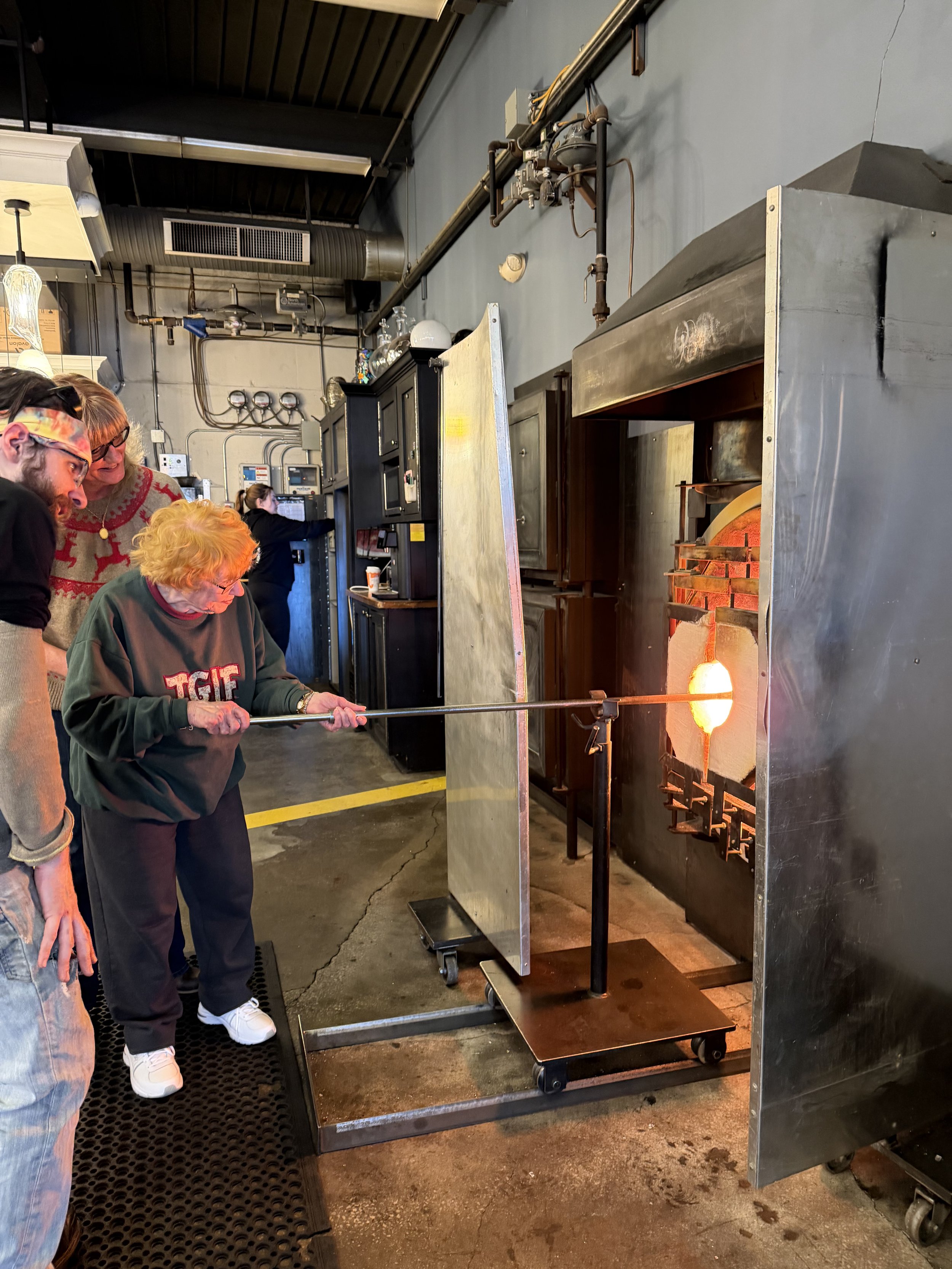 Glassblowing assisting grandmother with workshop