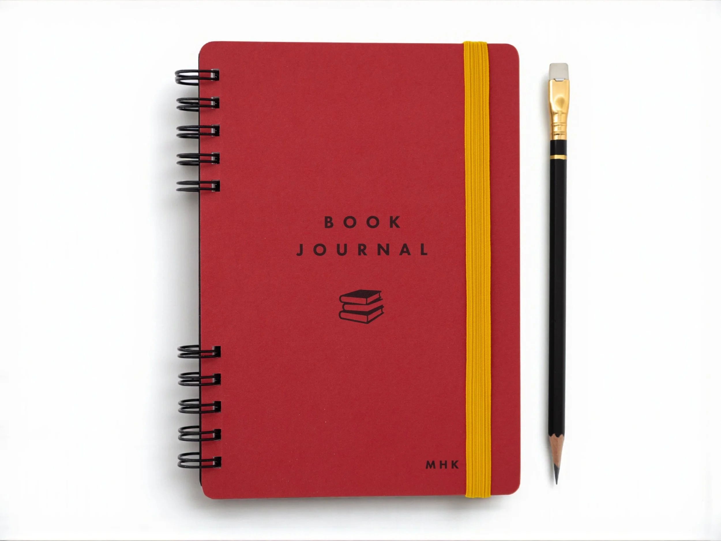 A red notebook with book journal on the cover
