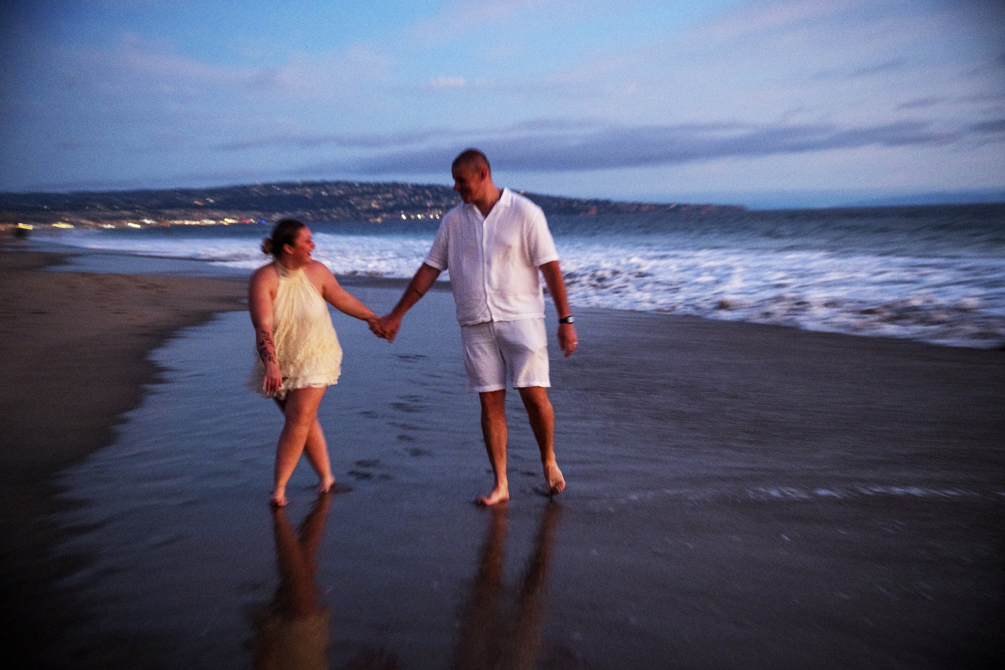 Maëlle and Djamel celebrate their engagement on the beach in Manhattan Beach.
