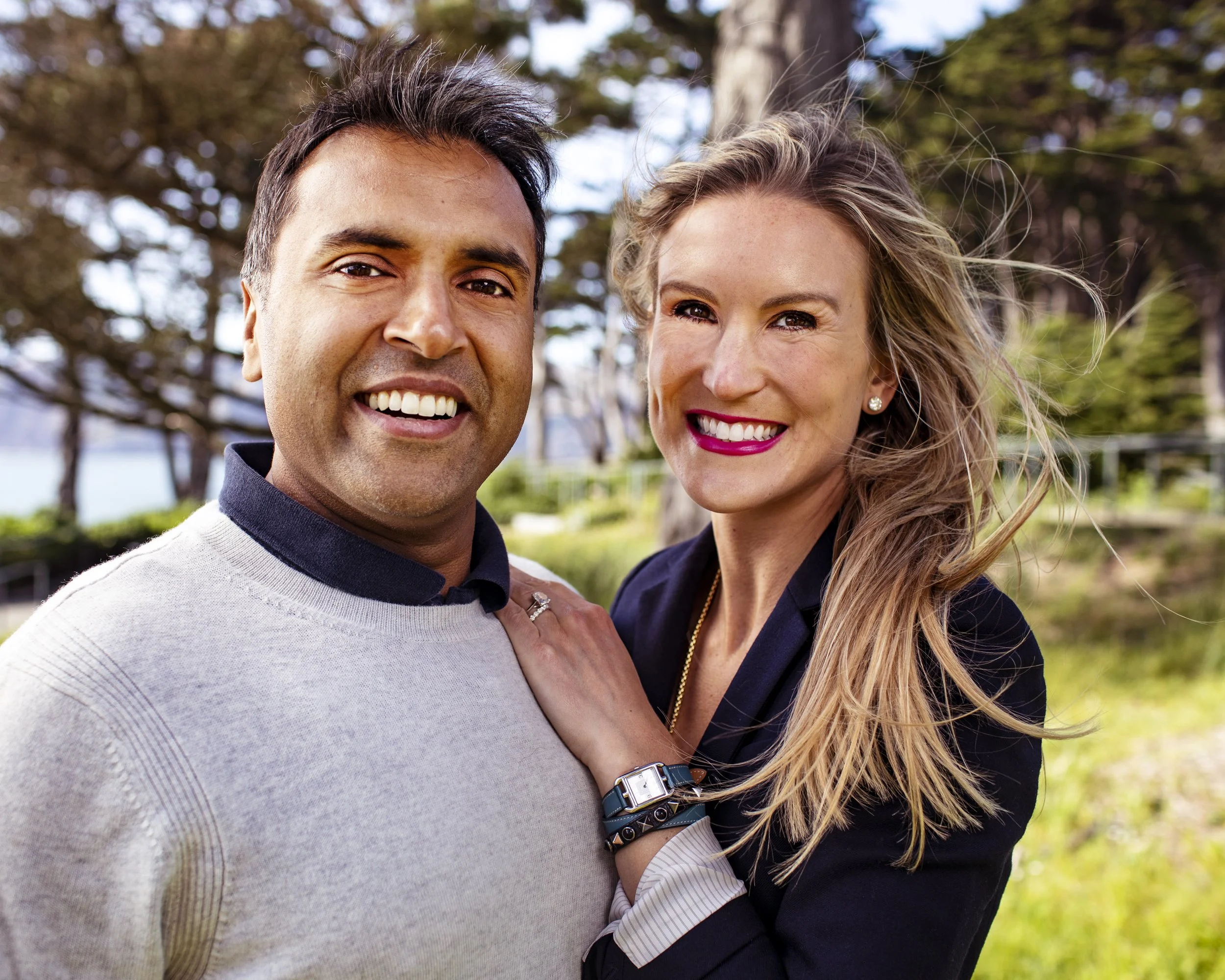 Couple smiling together during an outdoor portrait session.