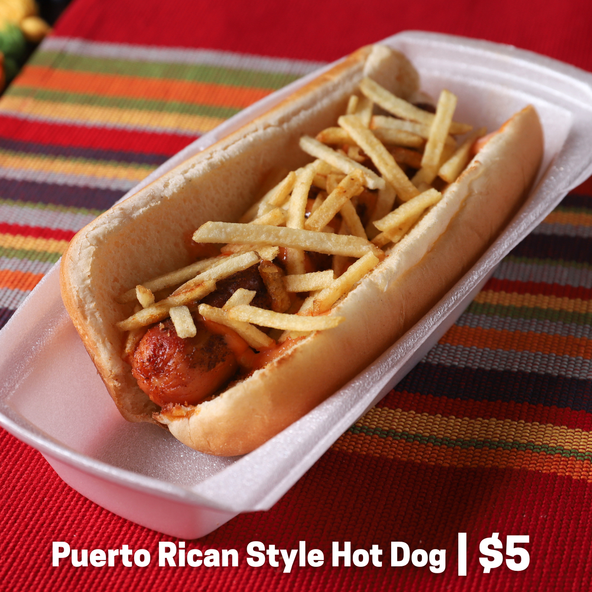 Hot dog with mayoketchup and topped with potato stix.
