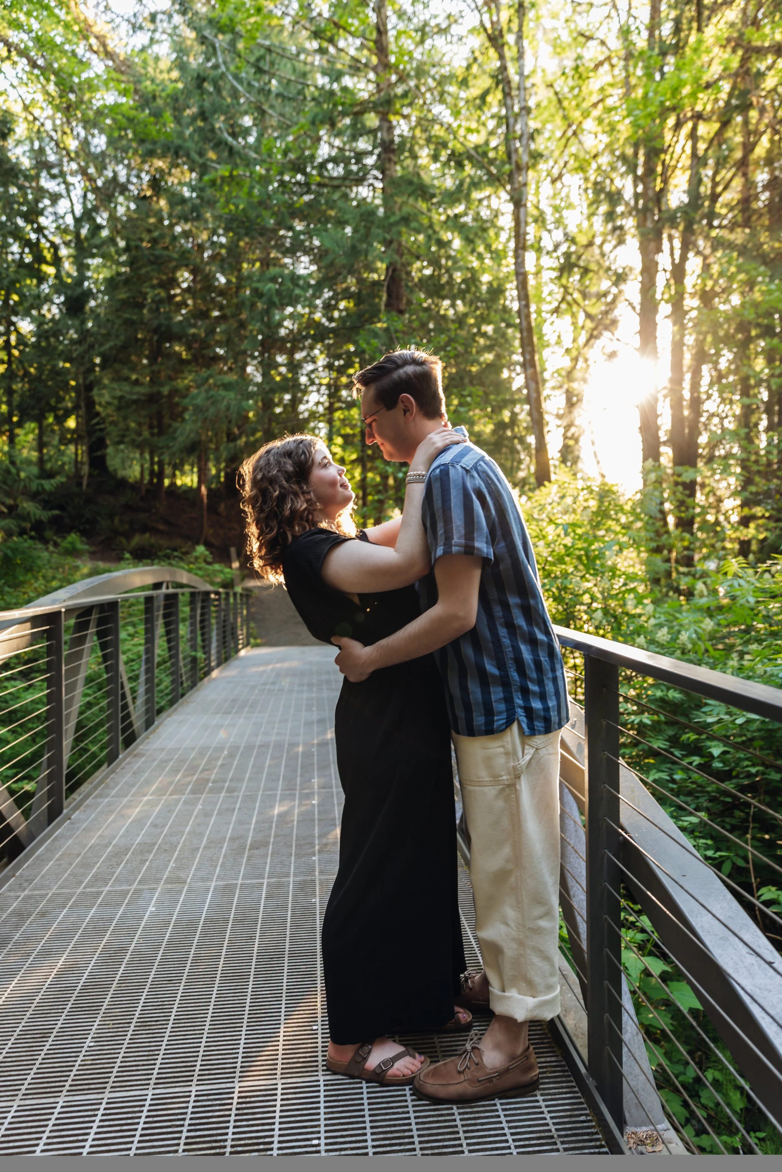 Engagement shoot with young couple on a bridge during Golden Hour