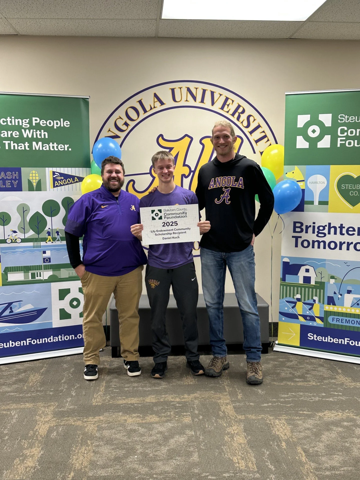 Daniel with Coaches.jpg