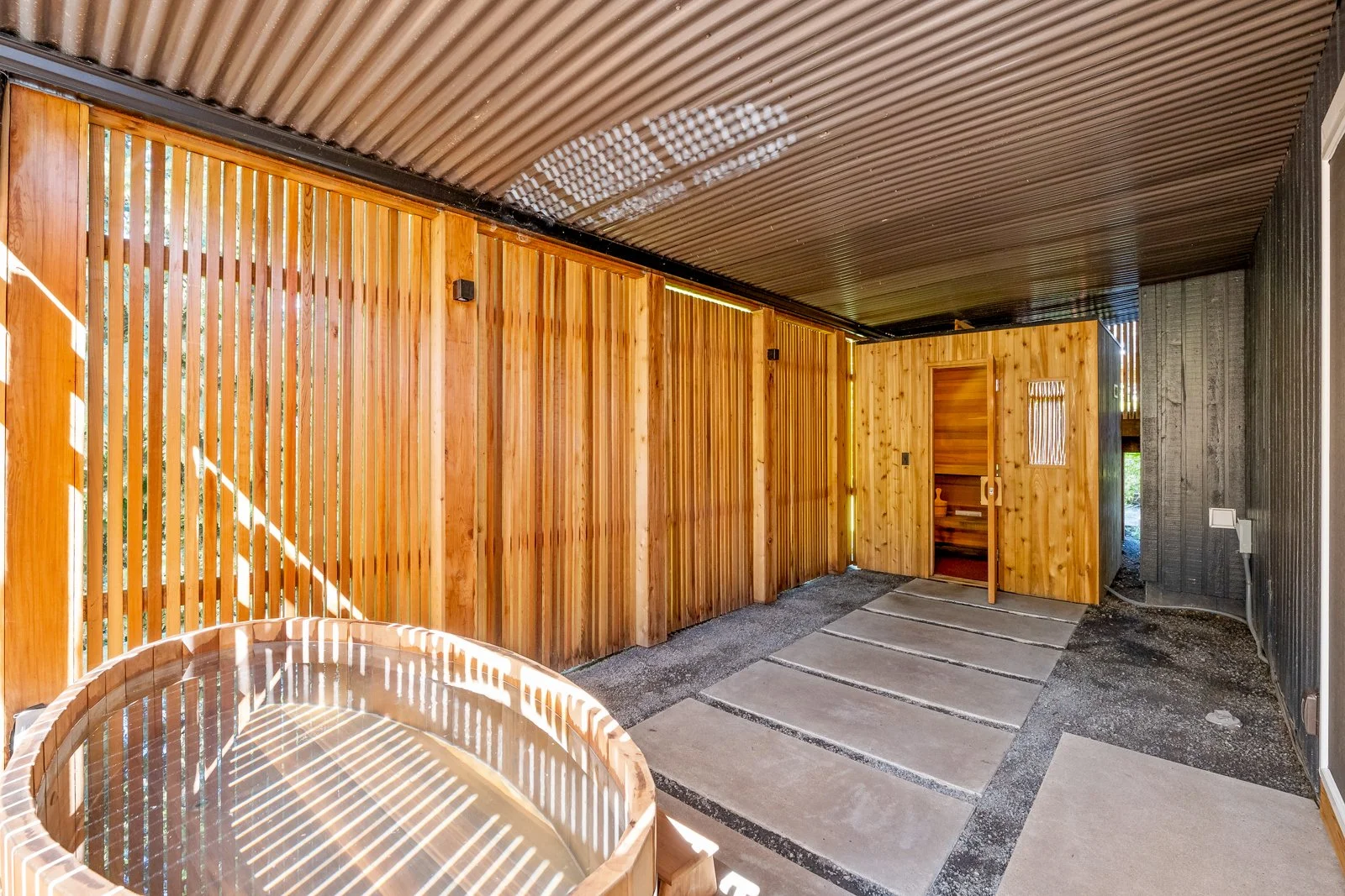 Sauna at Oswego
We created a robust, waterproof wellness area underneath the deck. This new space features a high-quality sauna, designed for ultimate relaxation and therapeutic benefits. Alongside the sauna, we also included a cold plunge pool, prov