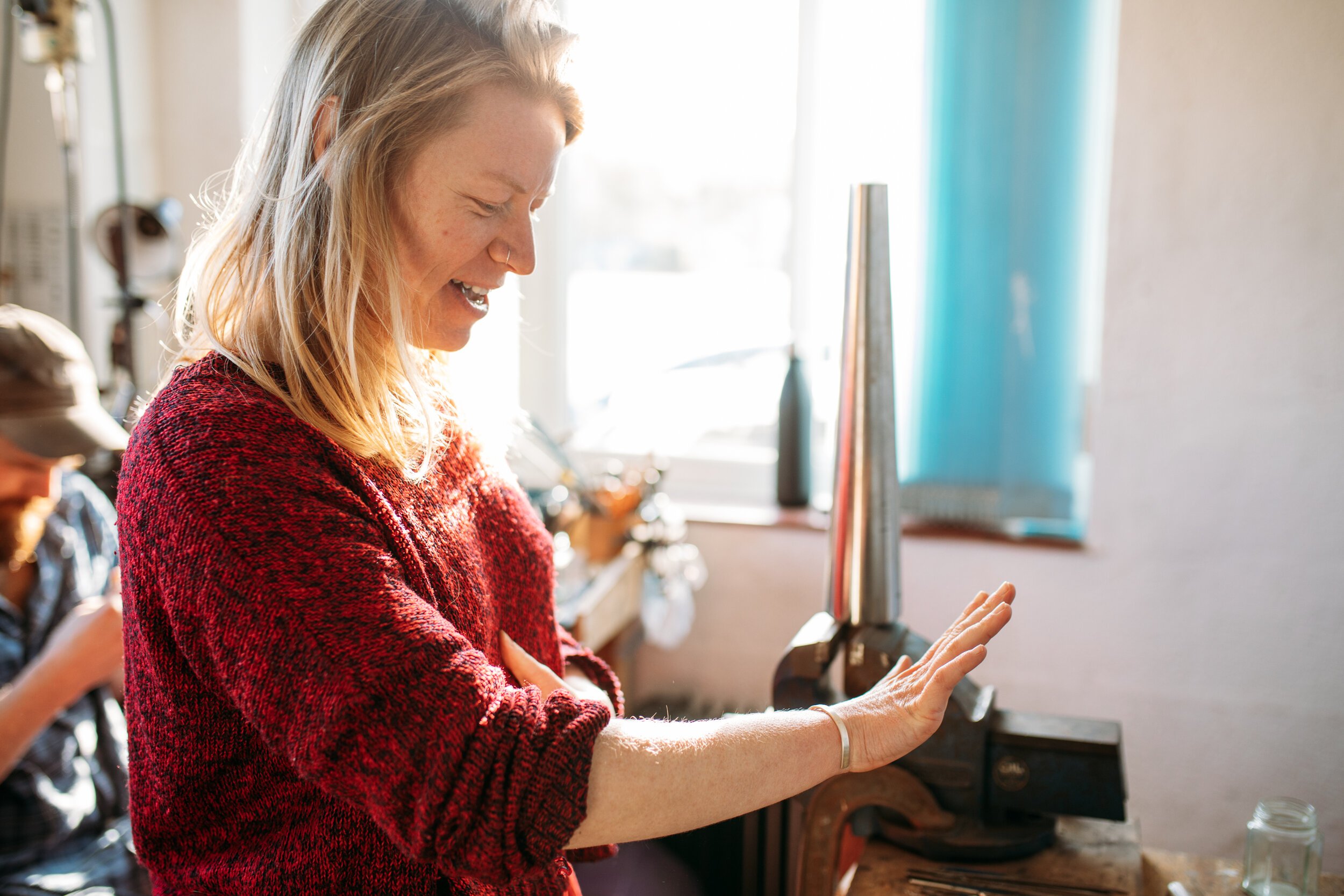 Woman admiring hand-made silver bangle