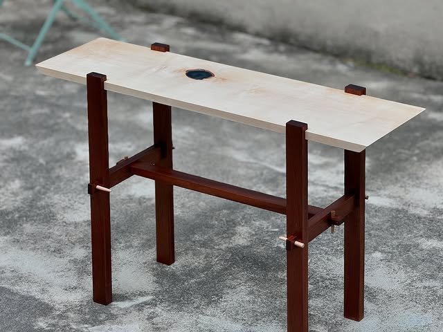 Sleek Japanese-style console table made of light wood, featuring clean lines and minimalist design, perfect for modern interiors.
