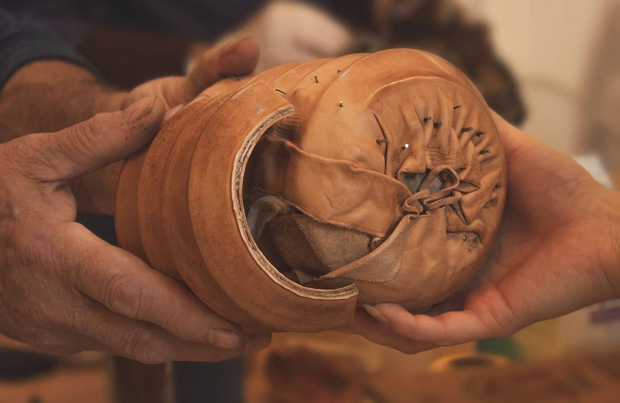 Person holding a handcrafted customized leather project.