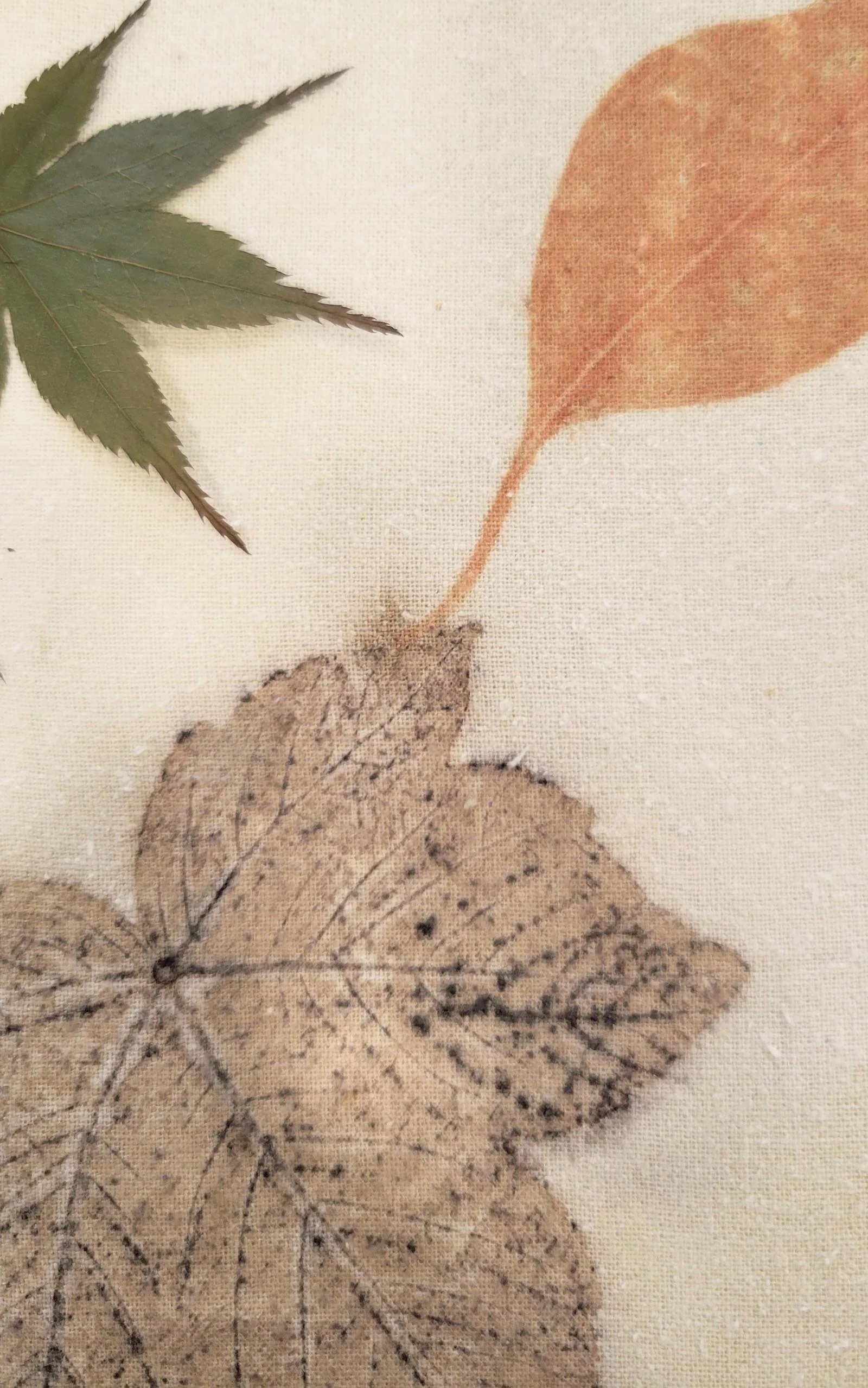 Detail of table runner with Japanese maple and other leaves