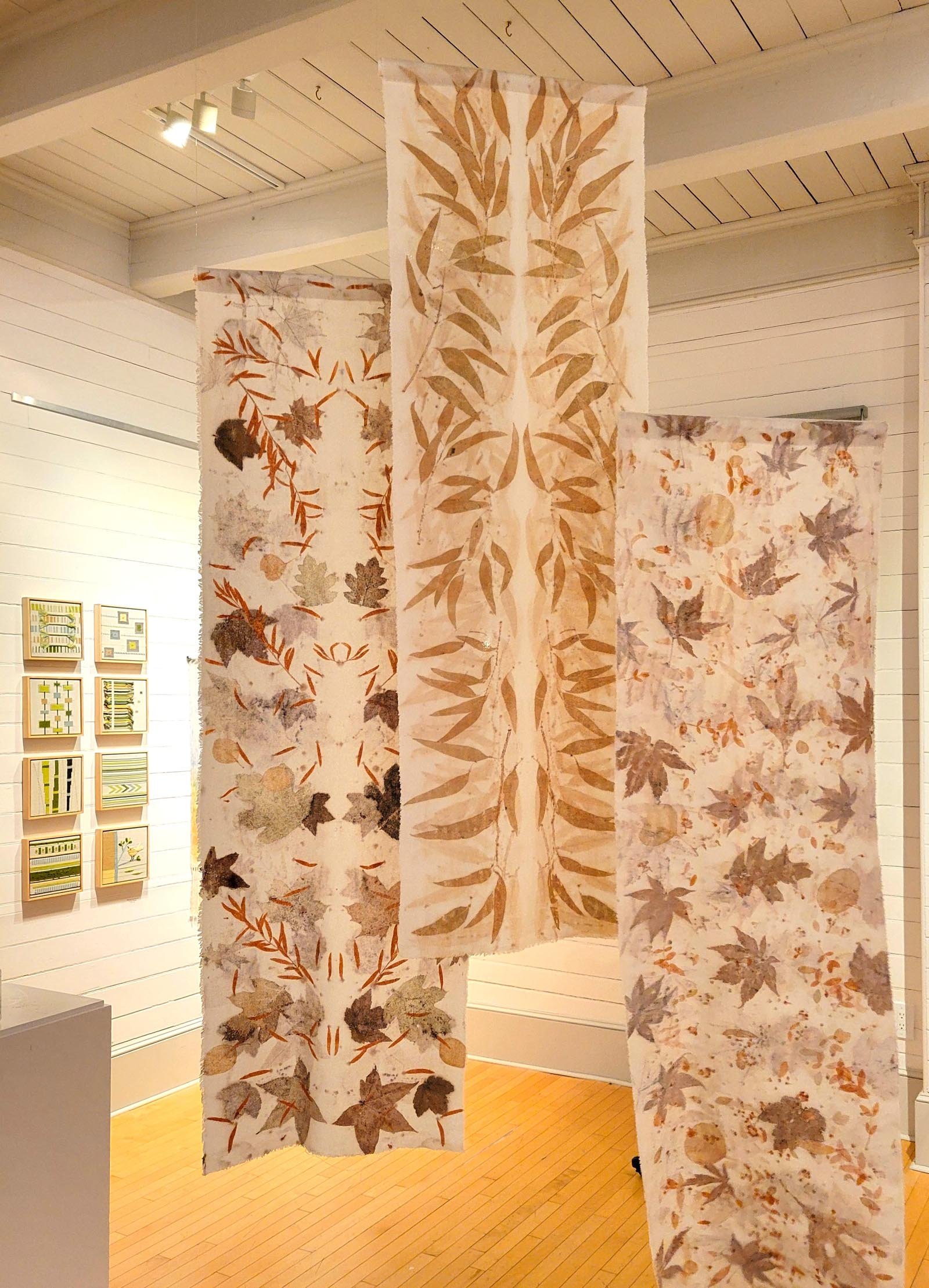 3 of Robyn Borges' wall hangings hanging at the Bristol Art Museum