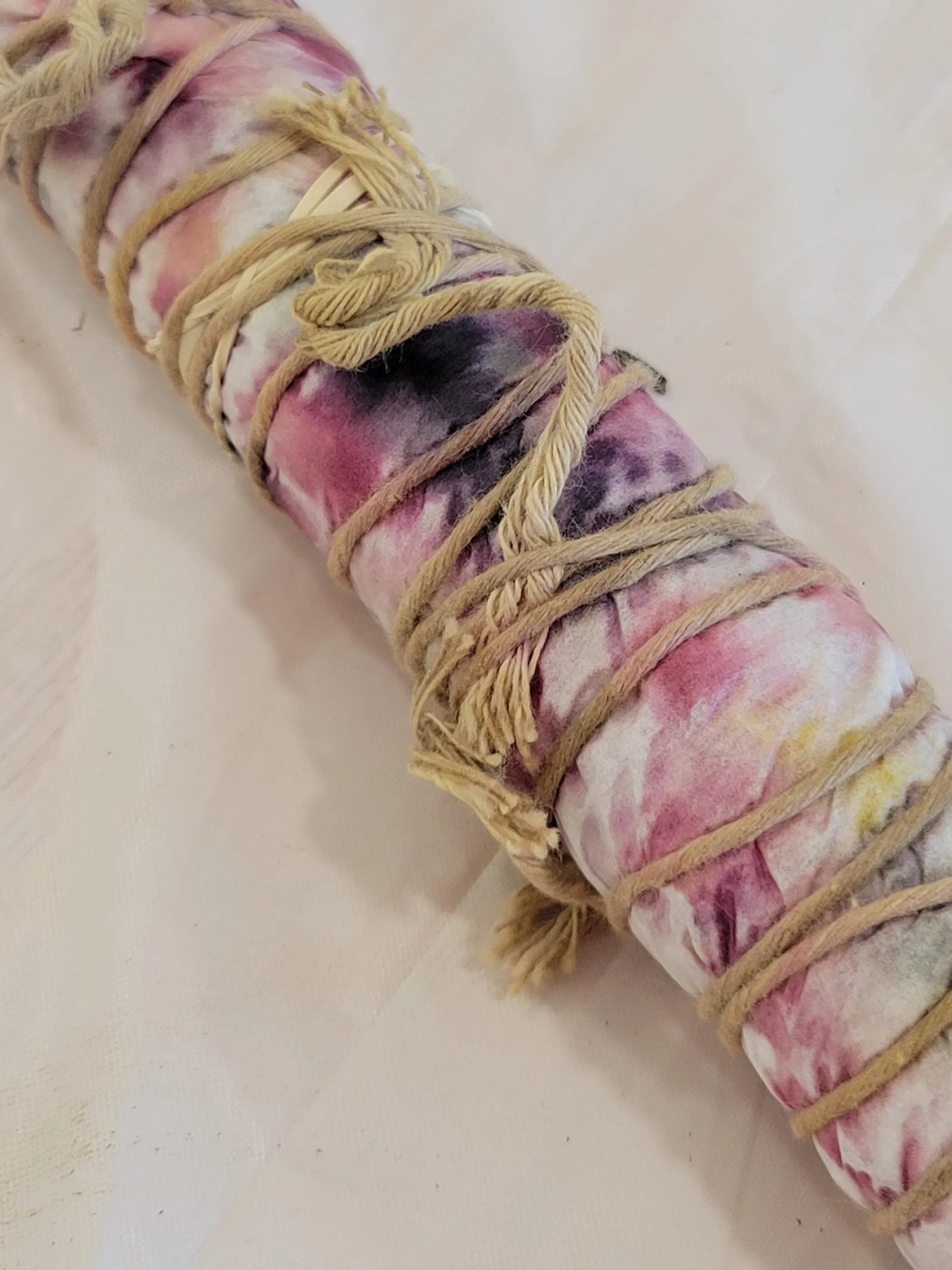 Dyed fabric rolled up and bound with twine