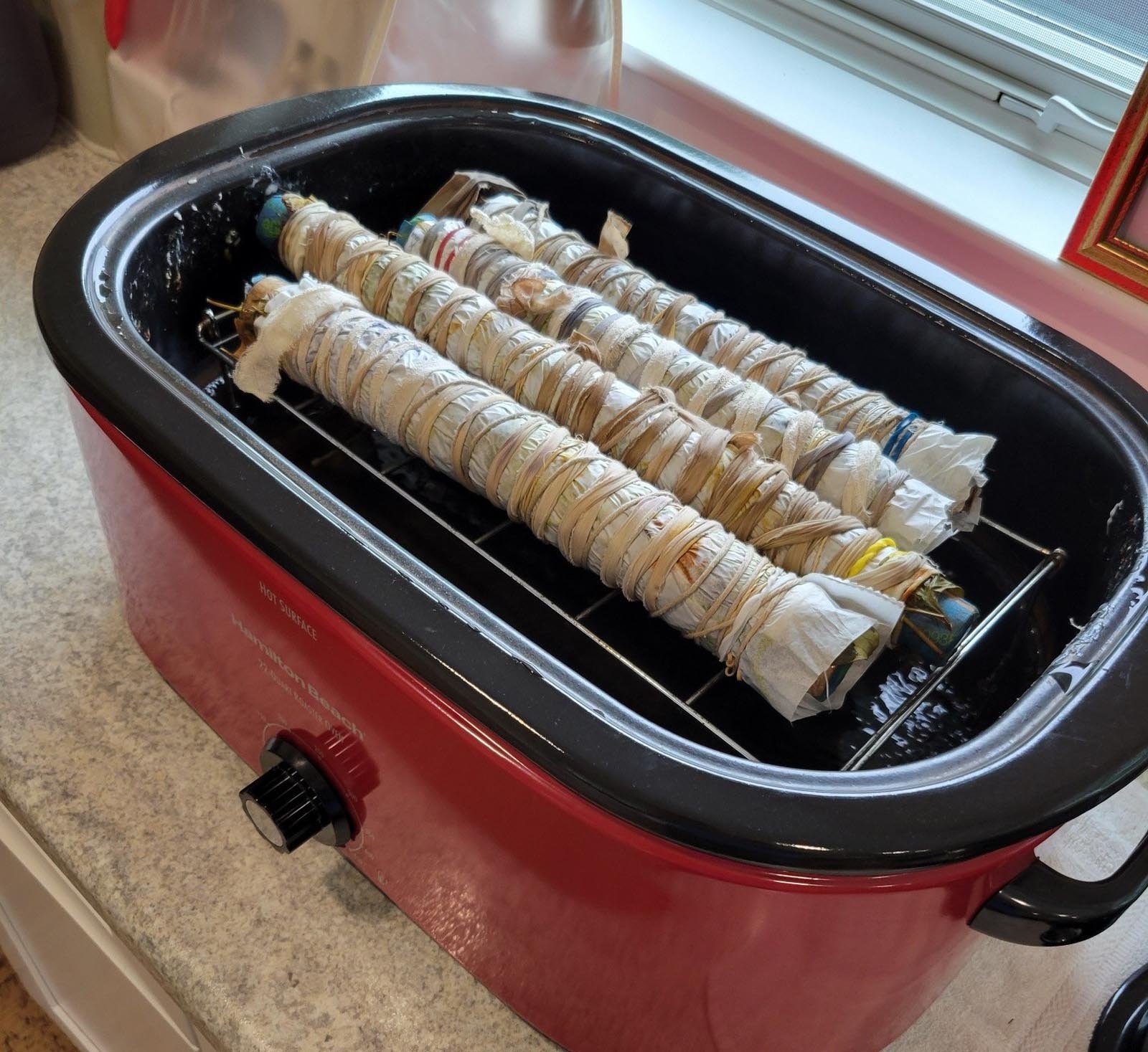 4 rolls of dyed fabric ready to be heated