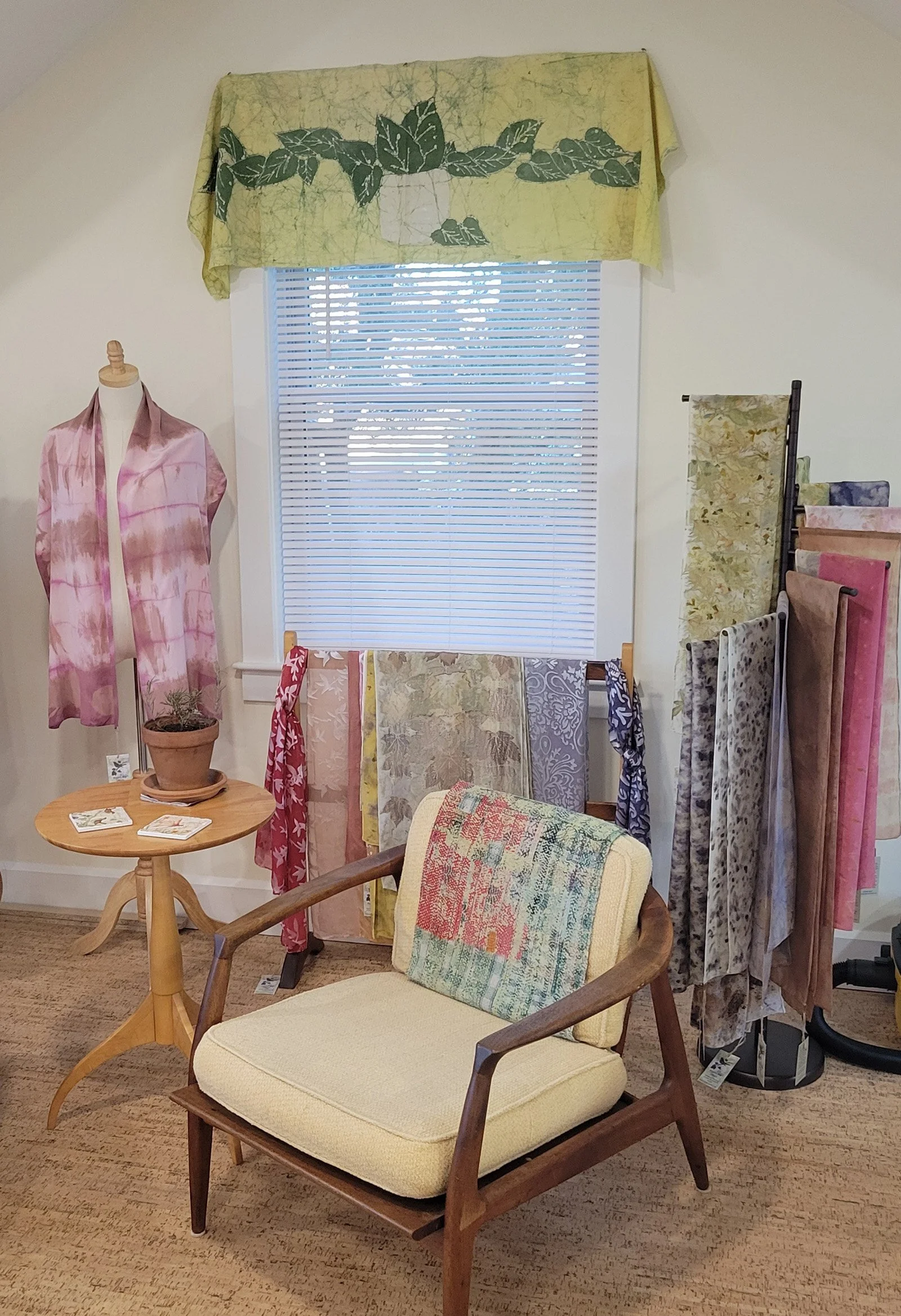 Robyn's studio with scarves, bandanas and more on display