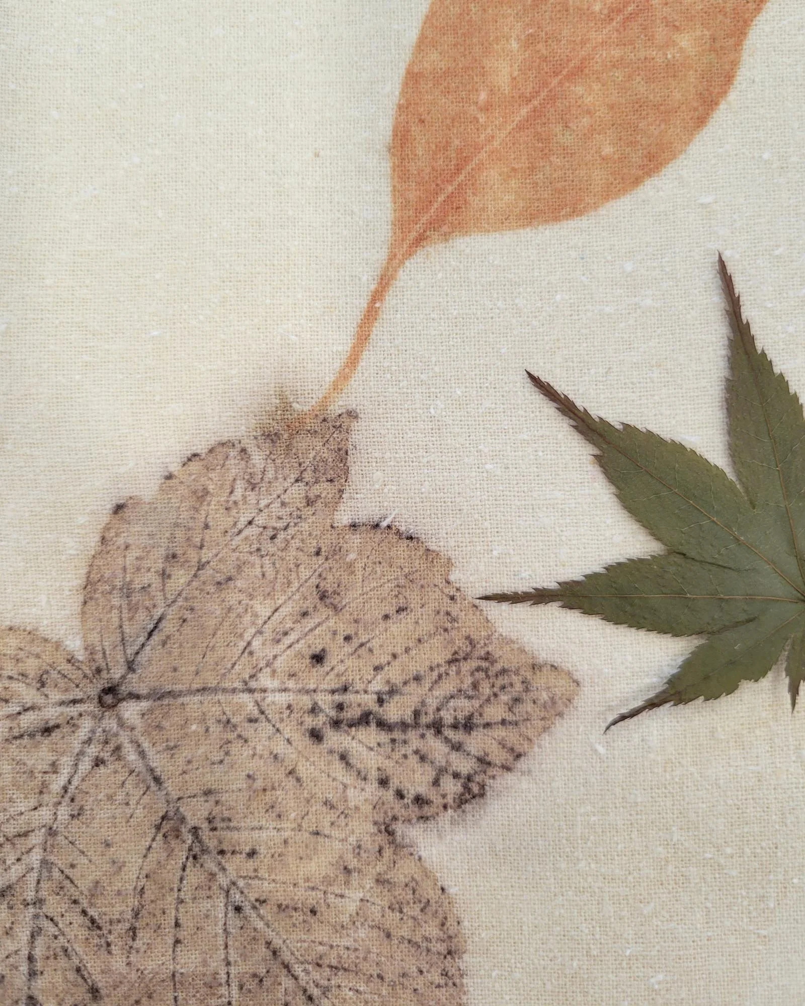 Detail of table runner with many leaves