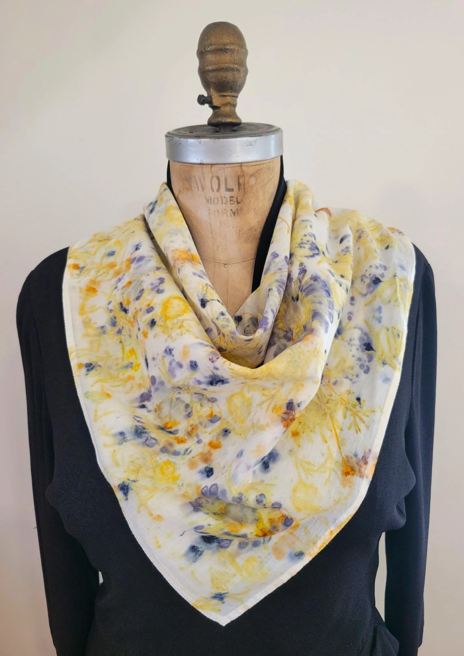 Yellow and blue bandana draped over mannequin chest