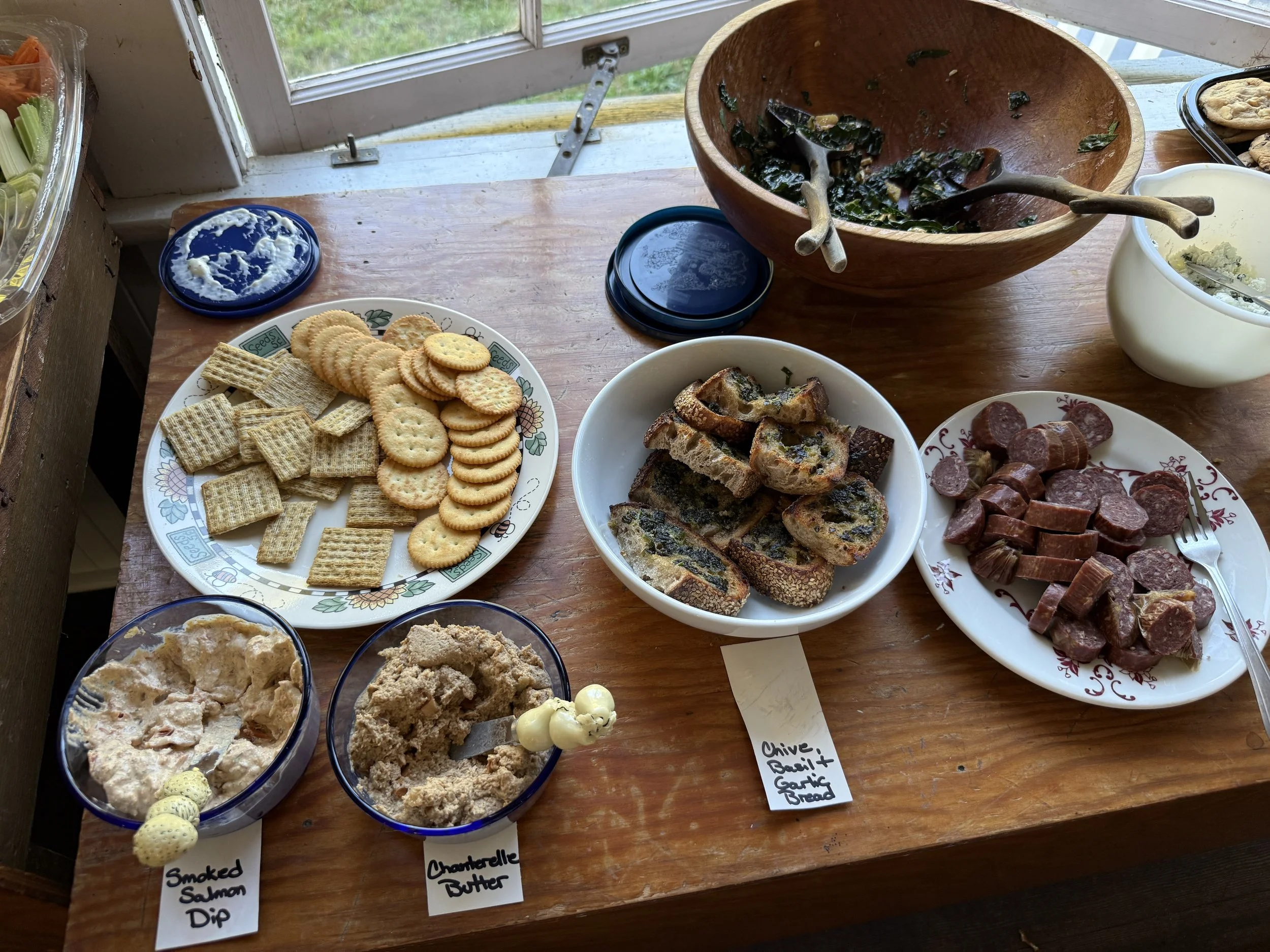 Home cooks identify food they brought to a closed-door potluck at the White Clover Range in Nehalem this month. (Penny Rosenberg/Oregon Journalism Project)