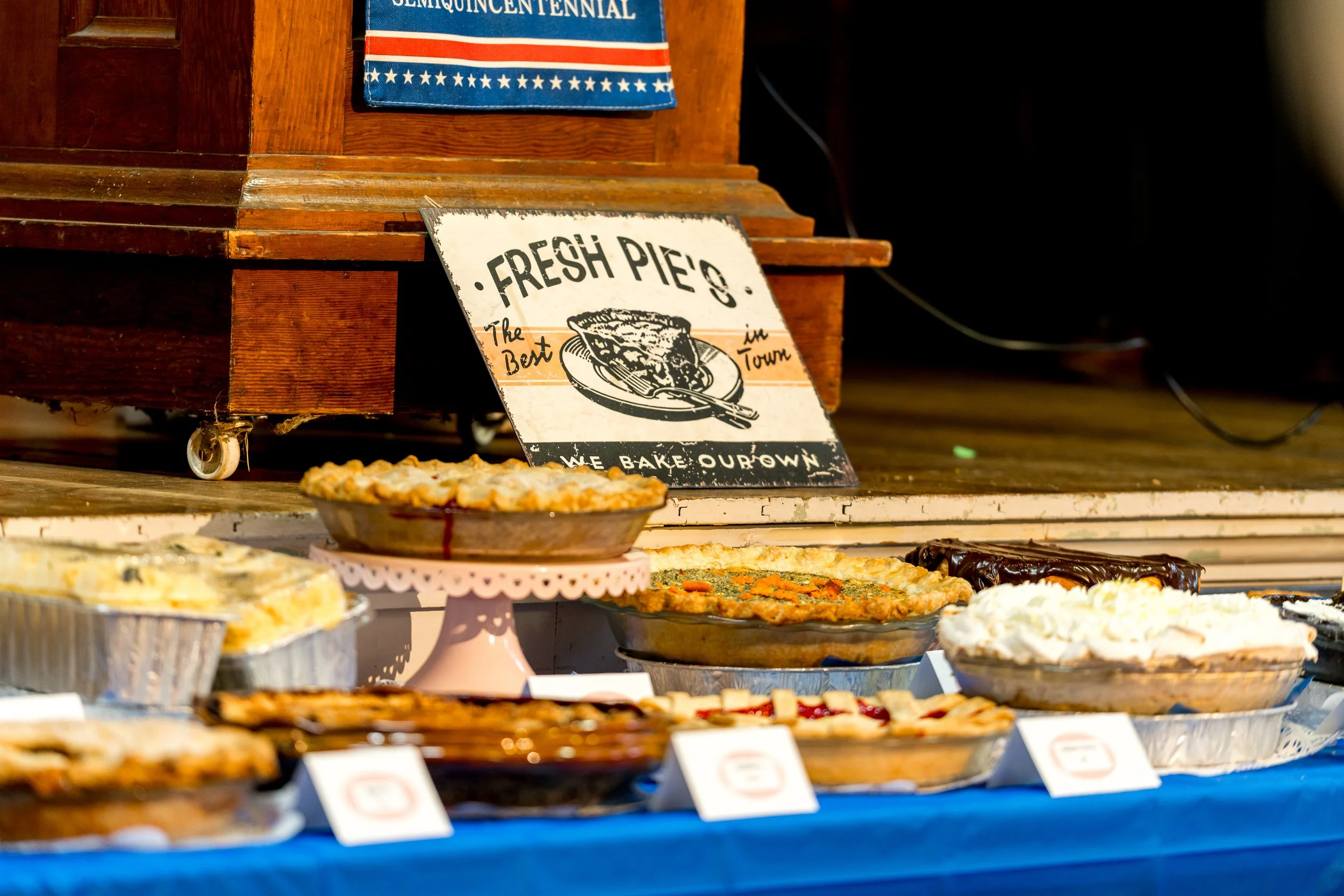 These homemade pies were auctioned for the White Clover Grange’s Pie Day earlier this year in Nehalem. The future of the fundraiser is now in jeopardy because it’s been deemed an illegal potluck. (Courtesy Trav Williams, Broken Banjo Photography)