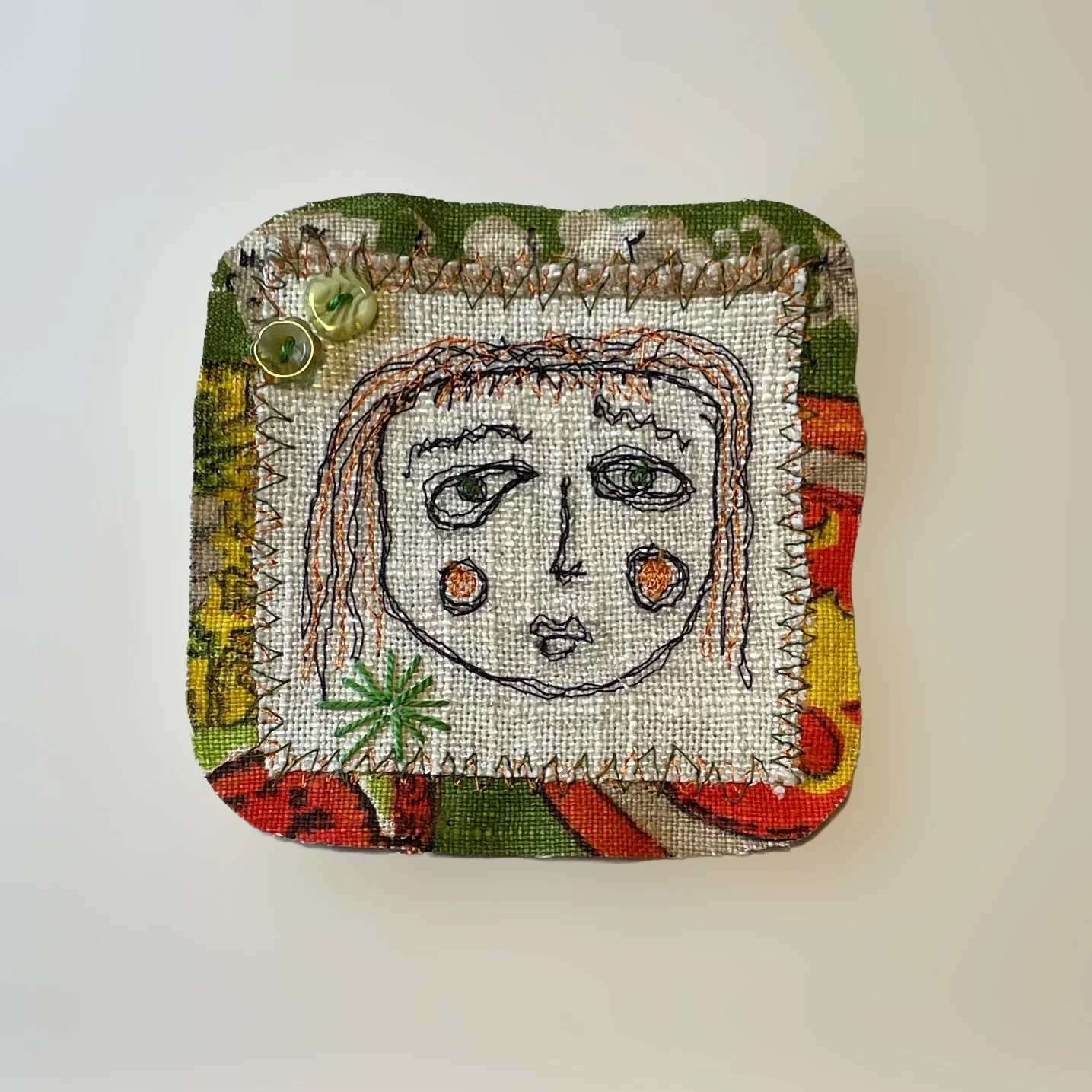 2024. Salvaged fabrics, embroidery thread, vintage buttons, double sided fusible fabric adhesive.