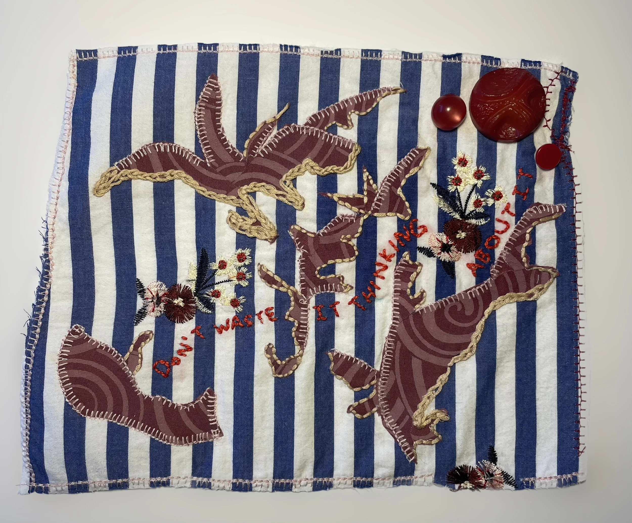 'Don't Waste it Thinking About it', 2024. Salvaged cotton and linen fabrics, embroidery thread, vintage buttons, double sided fusible fabric adhesive.