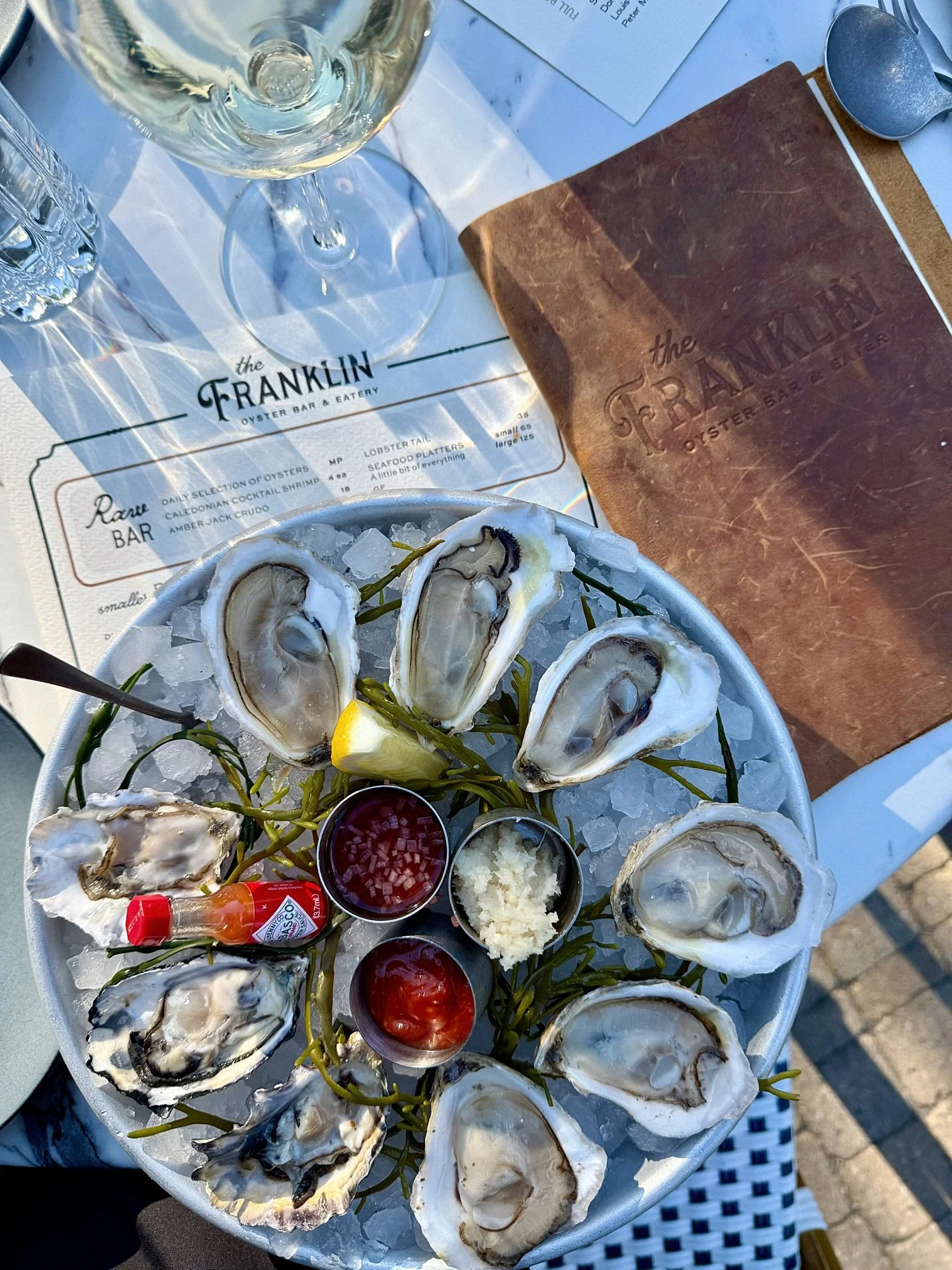 oysters &amp; white wine al fresco🤍

📸: @marikaannagaul @beeinthemomentcreations