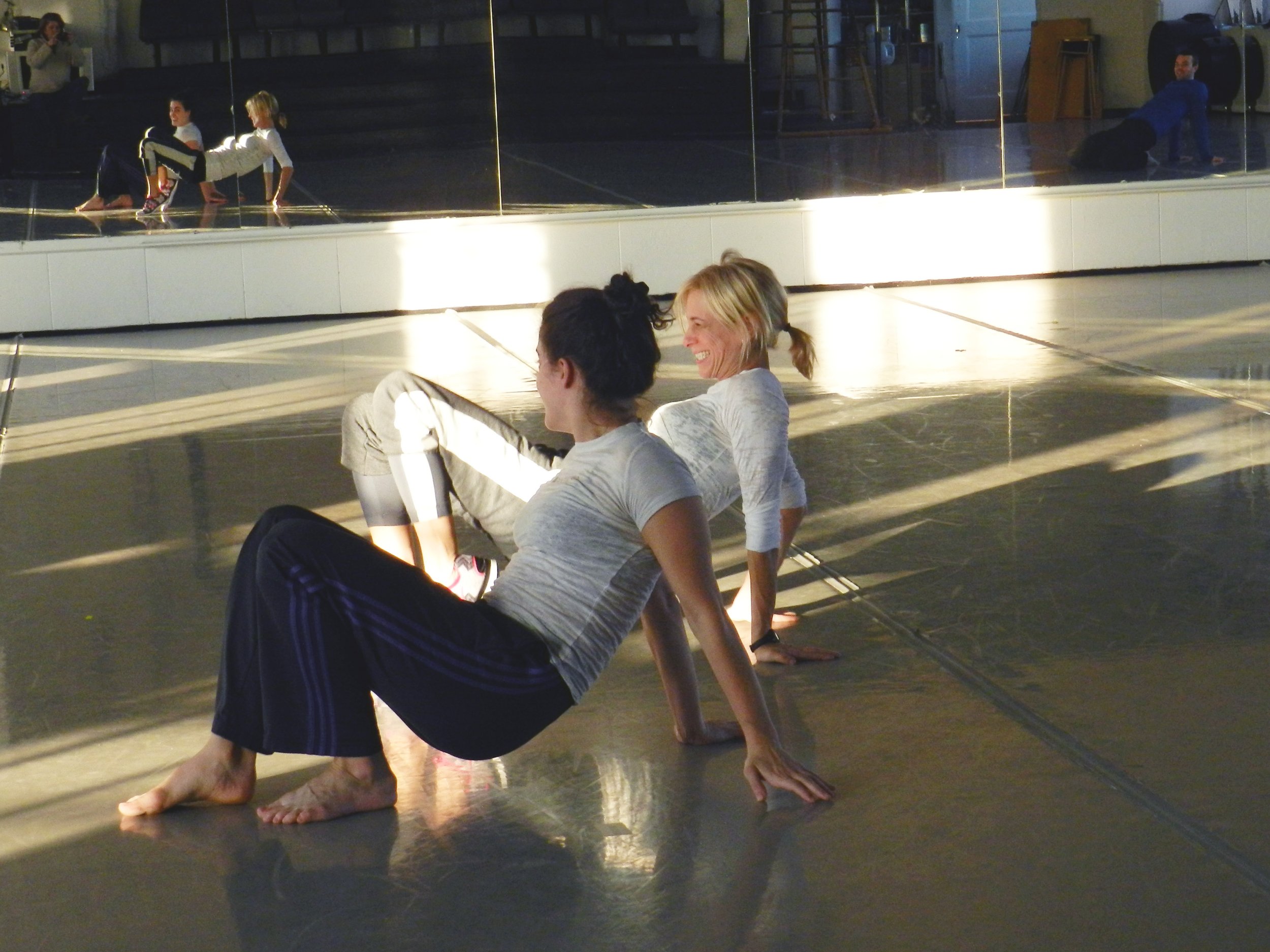 Liz Gerring showing a movement to a dancer