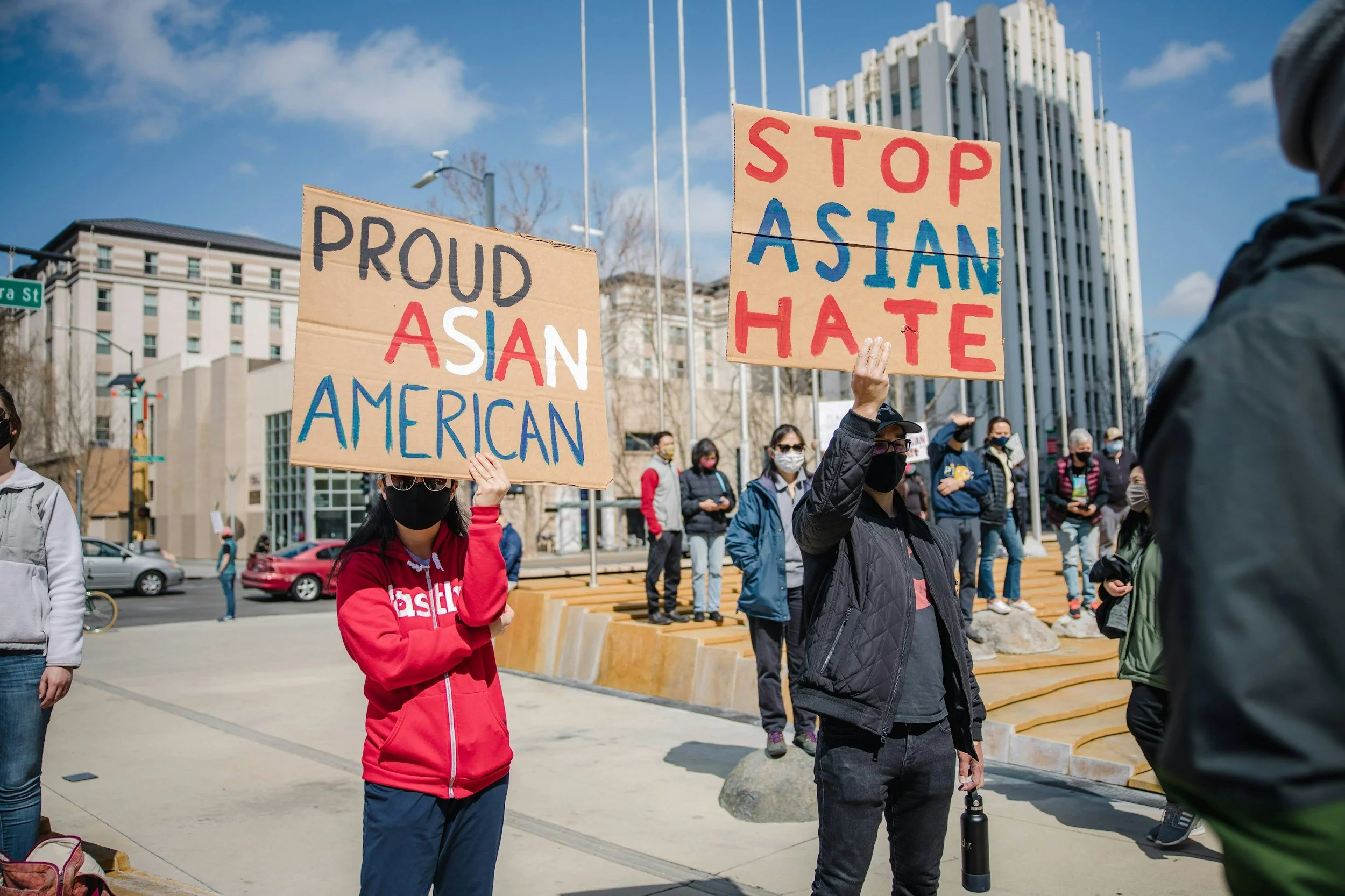 Marchers with placards for Asian Americans