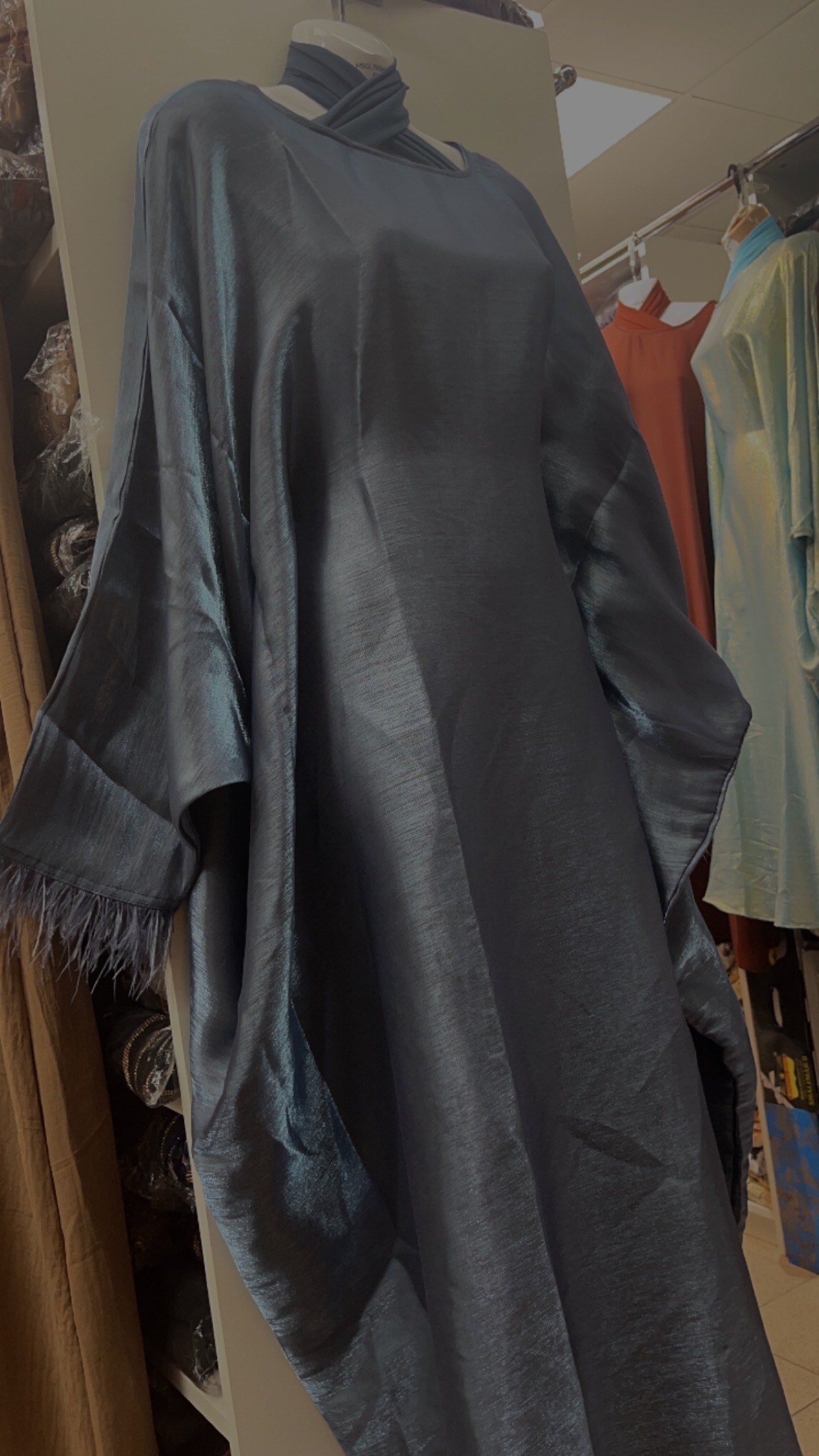 dark blue batwing abaya.