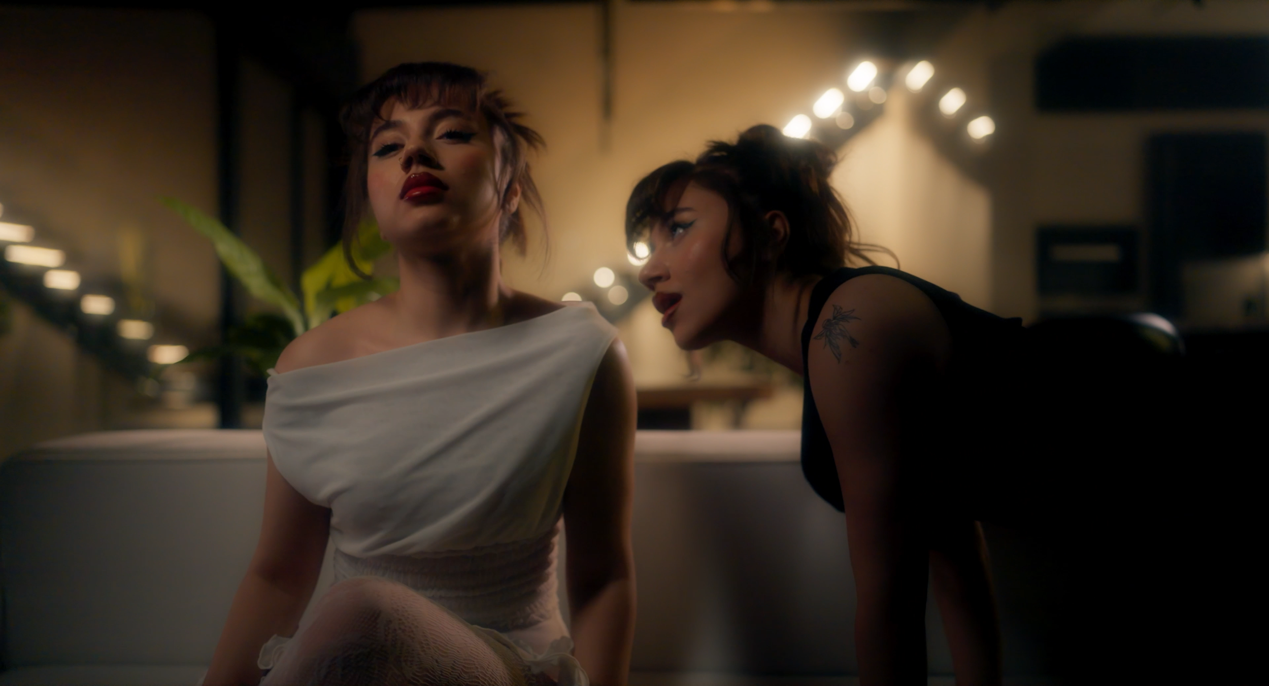 Music video still. Couple on date, silhouetted.