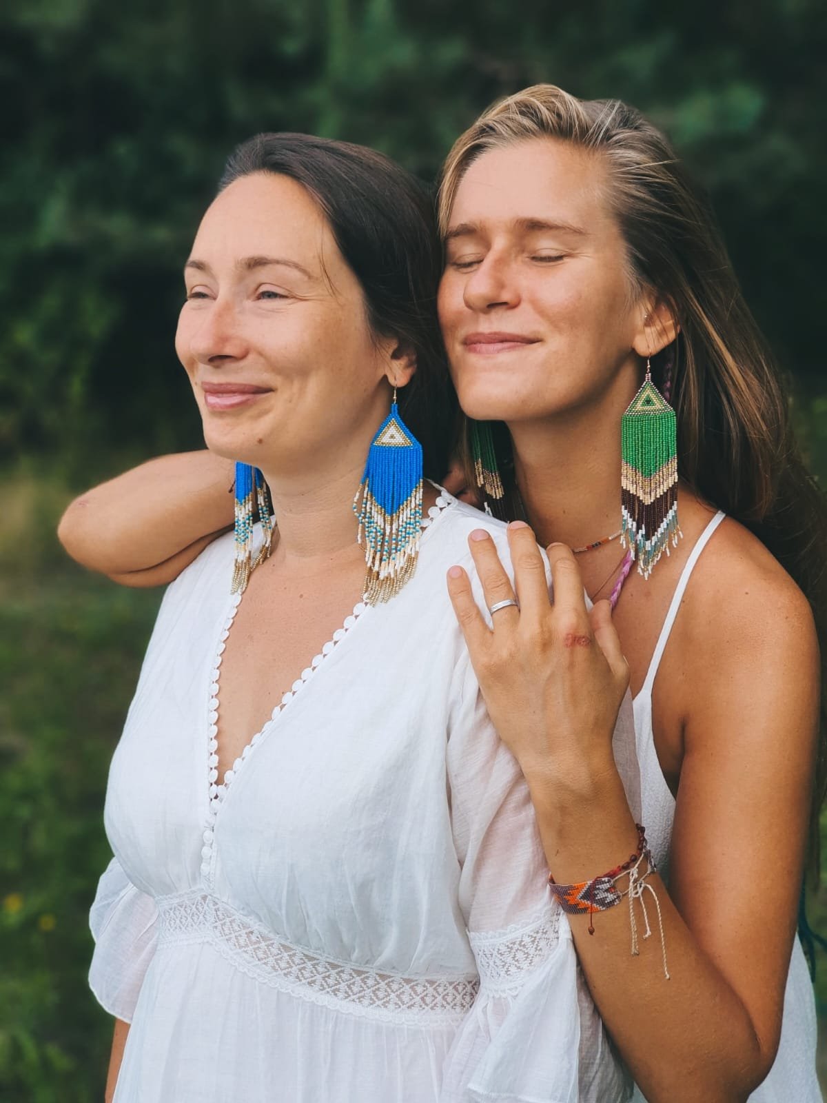 Friends together wearing handmade beaded earrings, coastal Mexico