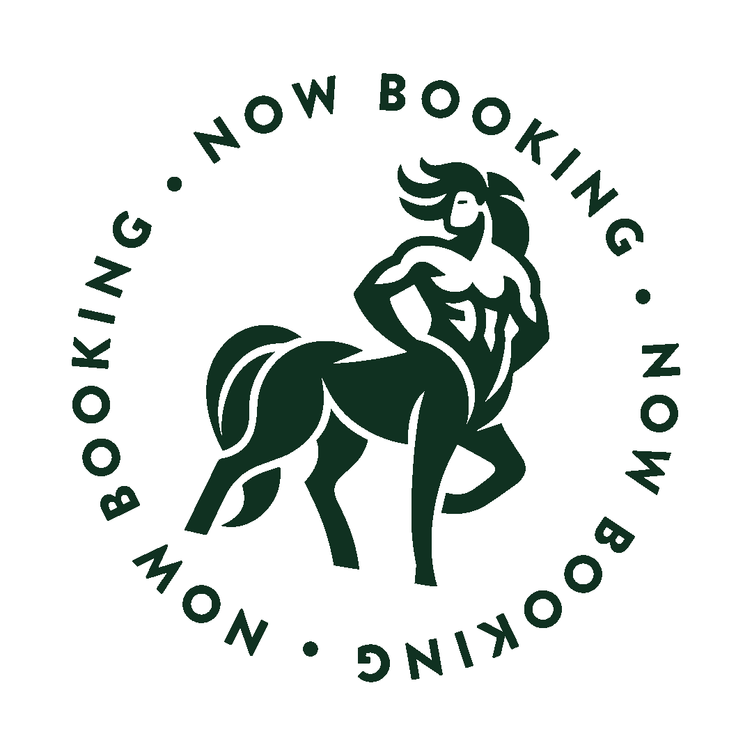A circular logo featuring a muscular, stylized centaur with a flowing mane and tail, and the text 'Now Booking' around the circumference.