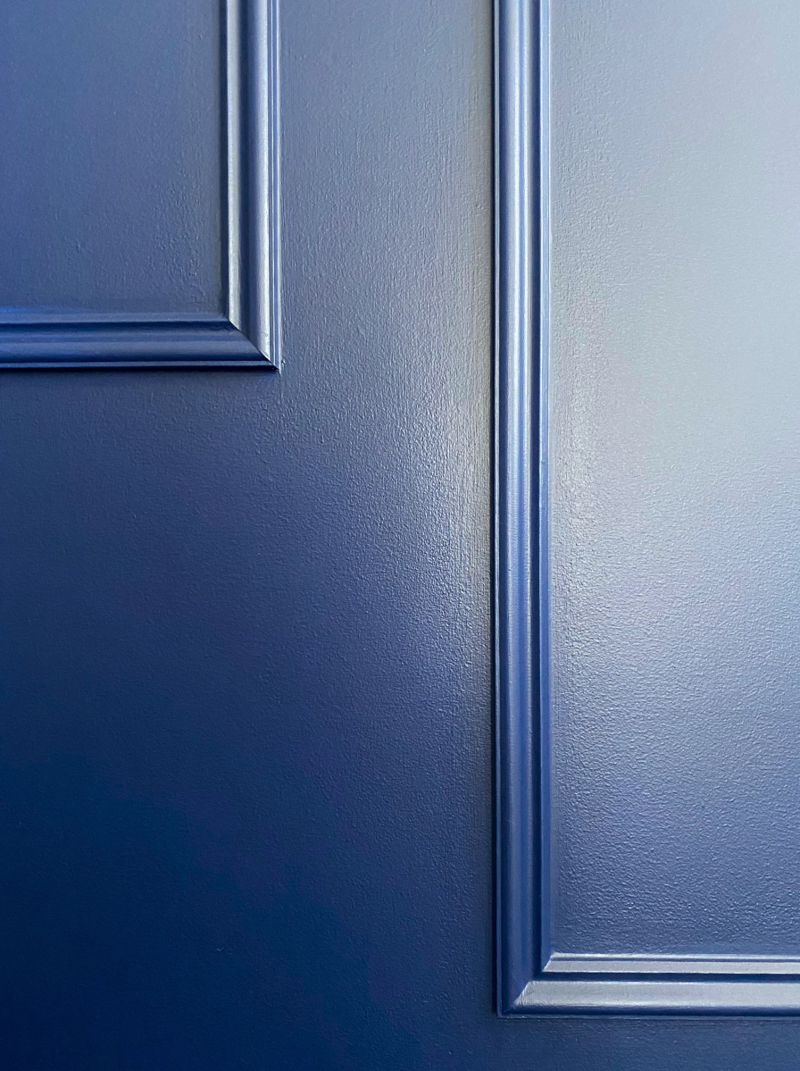 Blue painted wainscoting moulding closeup