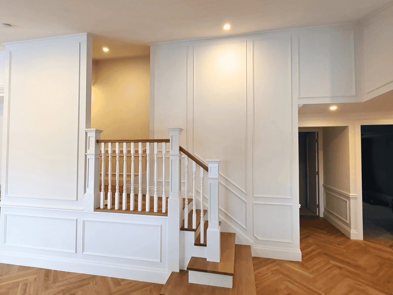 Full wall white wainscoting in hallway and staircase in Wollongong