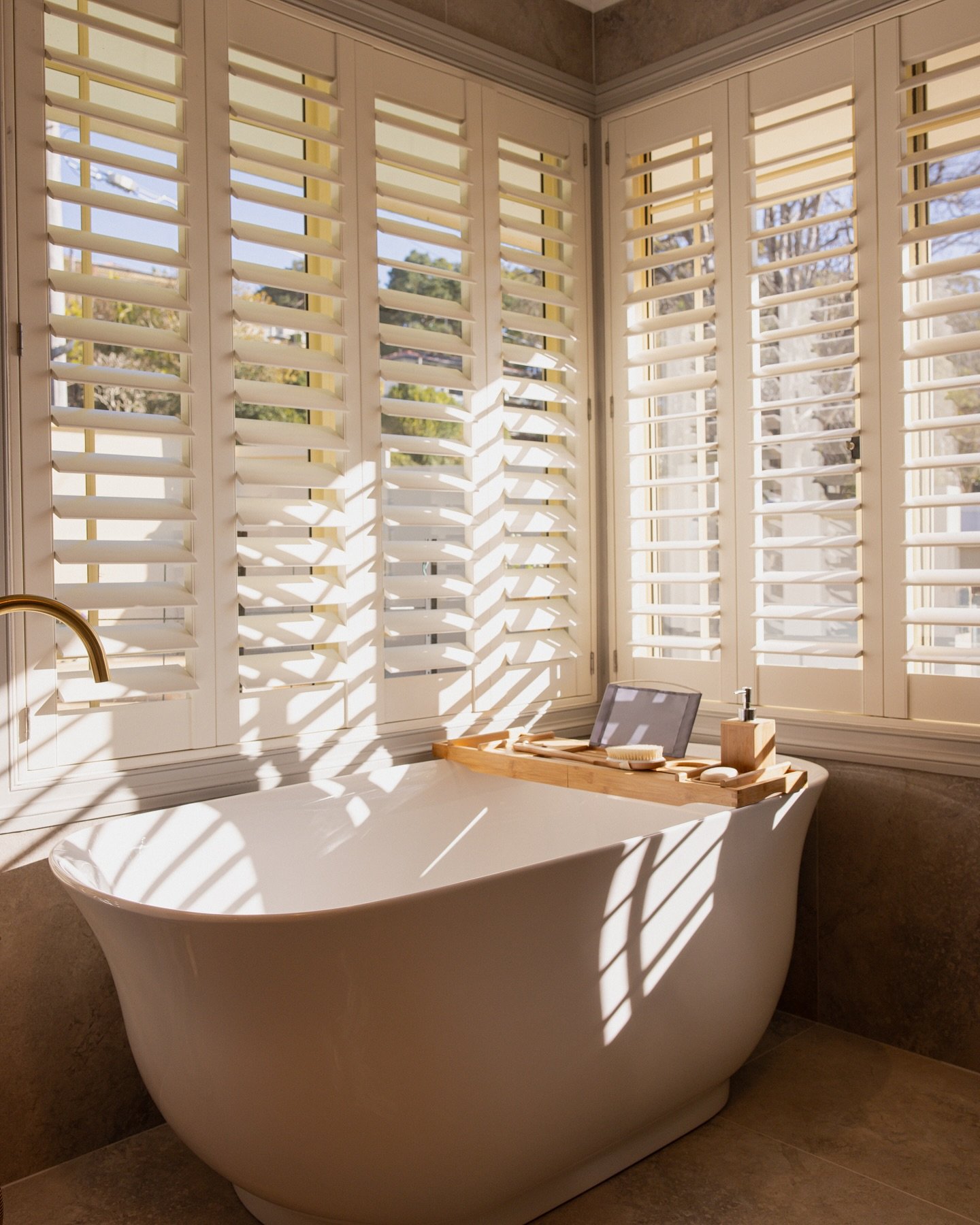 Imagine soaking in this free standing bath... 
We&rsquo;ve added floormounted polished brass tapware and selected herringbone feature tiles that perfectly match the calming blue of the pool outside. With open shutters bringing the outdoors in, it&rsq