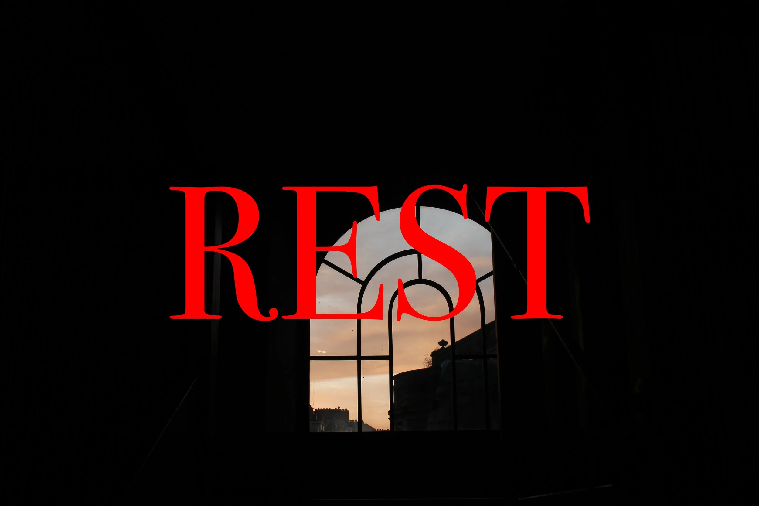 Dark interior space with a window showing a sunset sky and buildings outside, overlaid with the word 'RESIST' in large red letters.