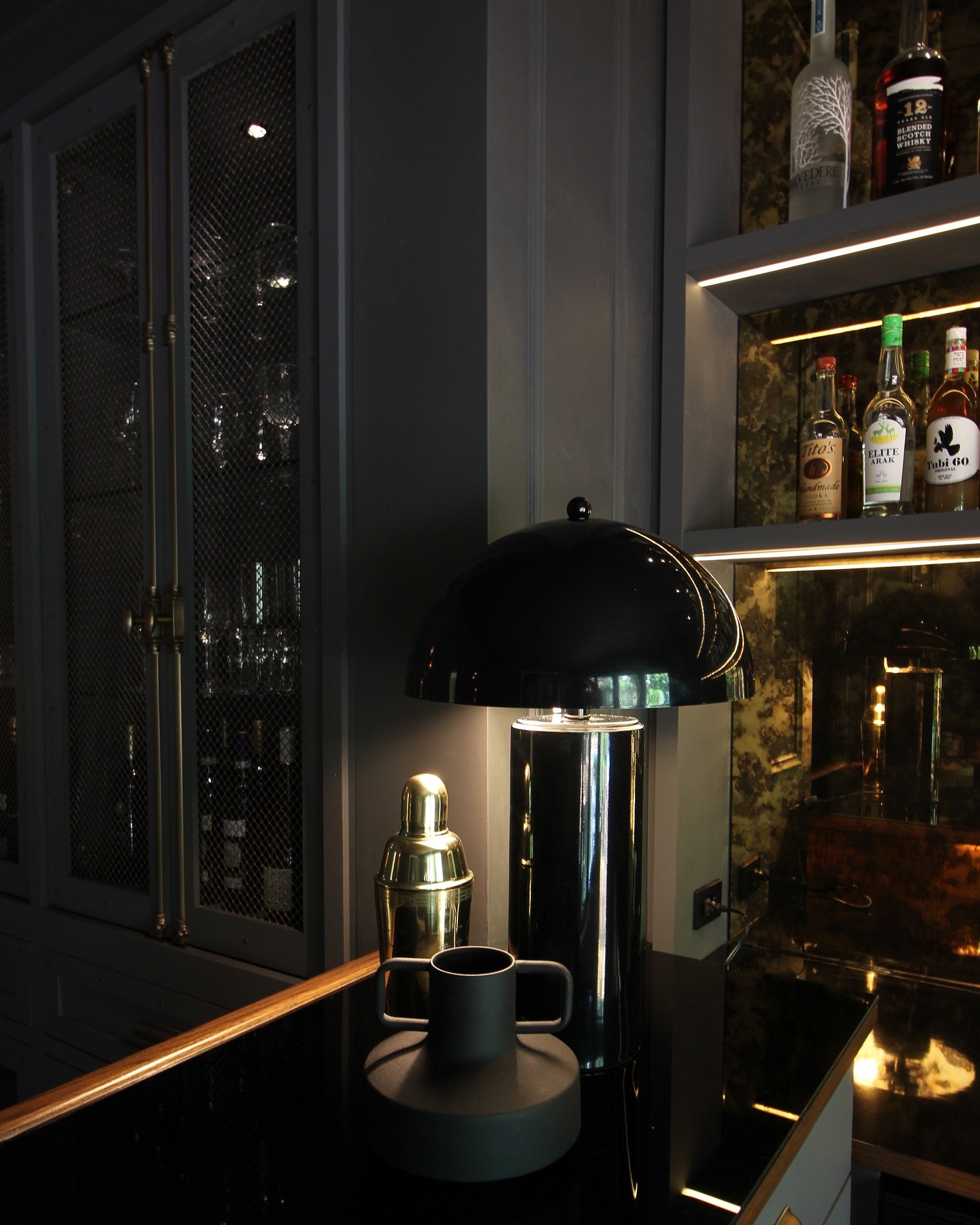 More photos of one of my favorite spaces for one of my favorite clients. 

We minimized contrast and increased glow to create a moody, masculine bar lounge&mdash;an intimate space inviting both solitude and celebration.

Black back-painted glass, ant