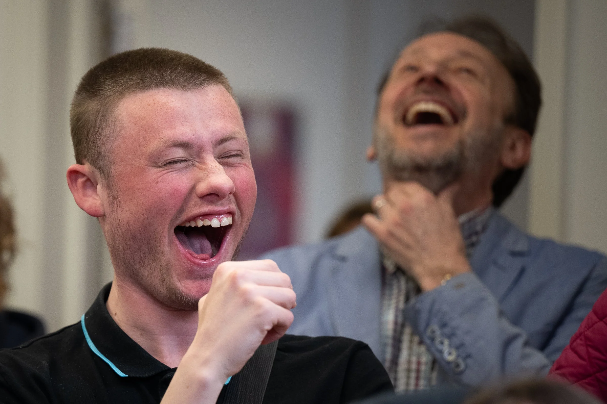 Two men laughing