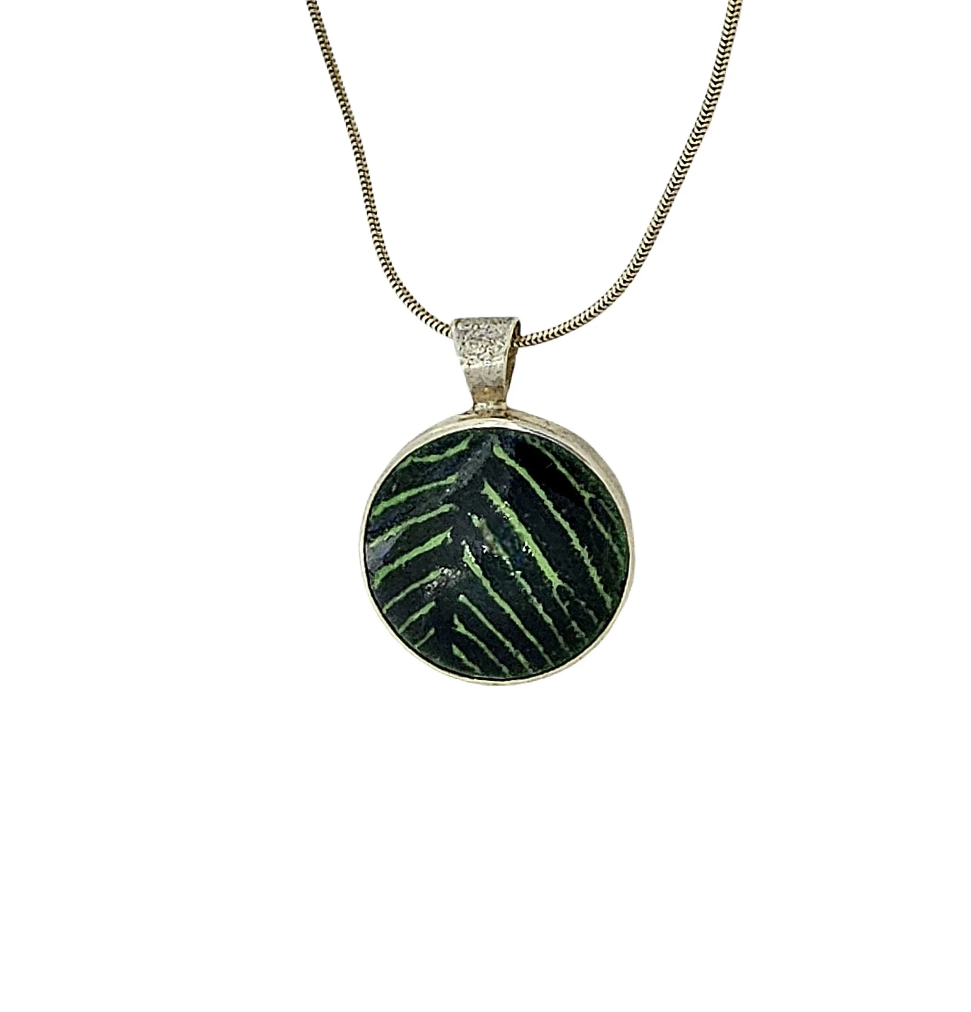 Green on green enamel enamel pendant set in sterling silver.