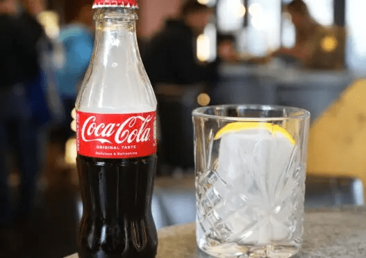 inside-gallery-cocacola-bottle-and-a-glass-cup-filled-with-ice.png