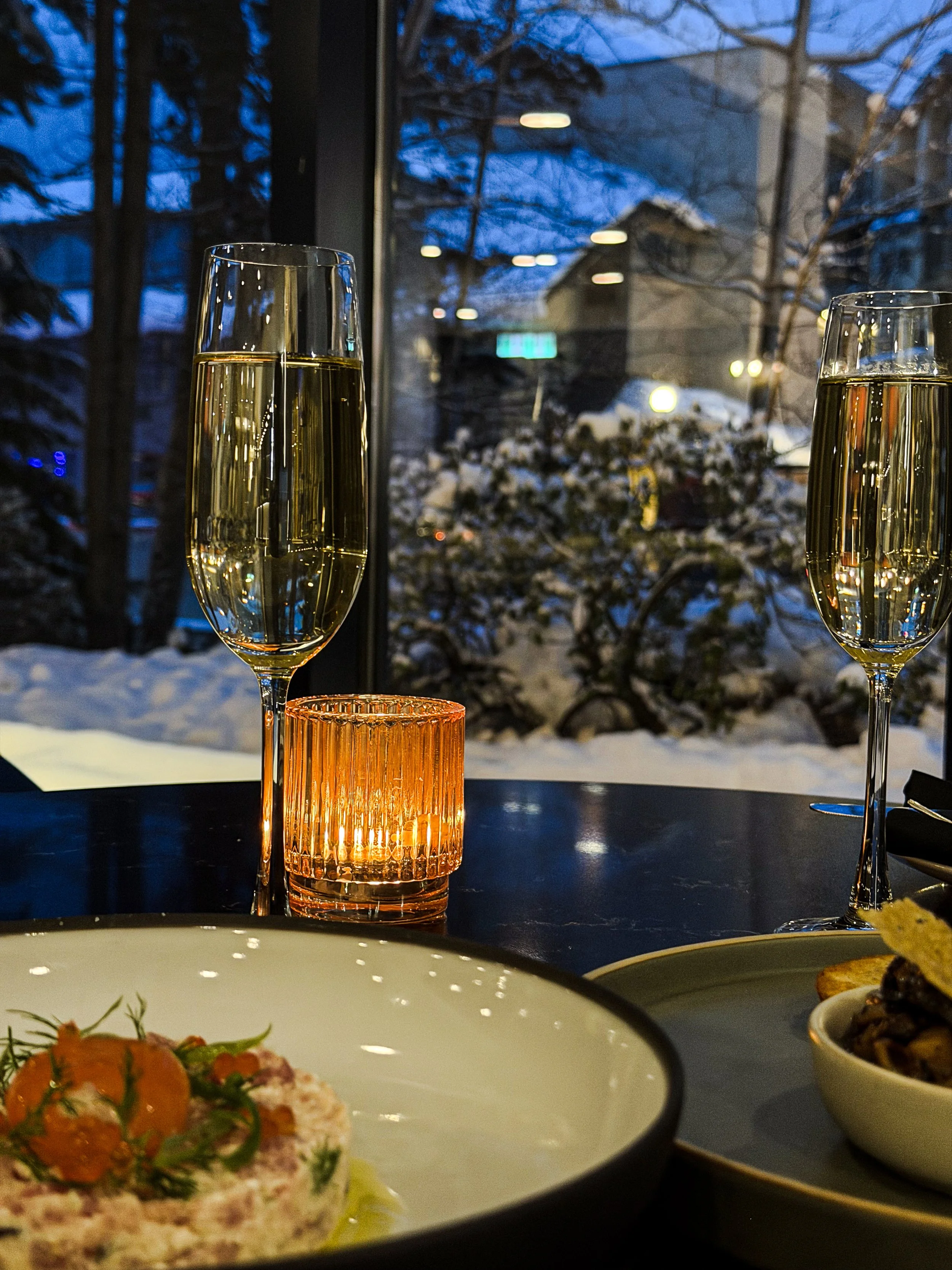 Champagne and Fine Dining by Window with Winter View.jpg