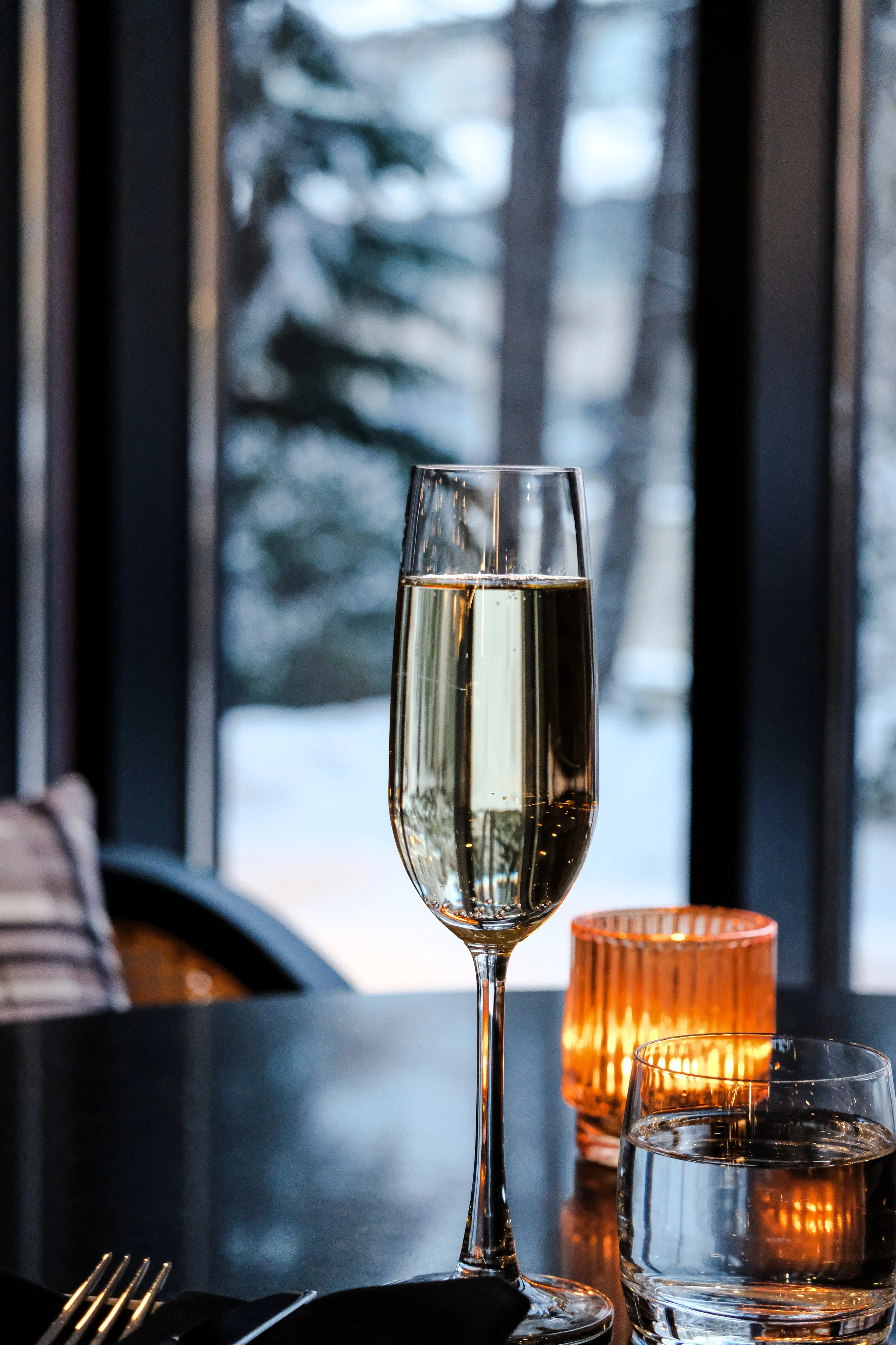 Champagne and Candlelight by Window During Winter Evening.jpg