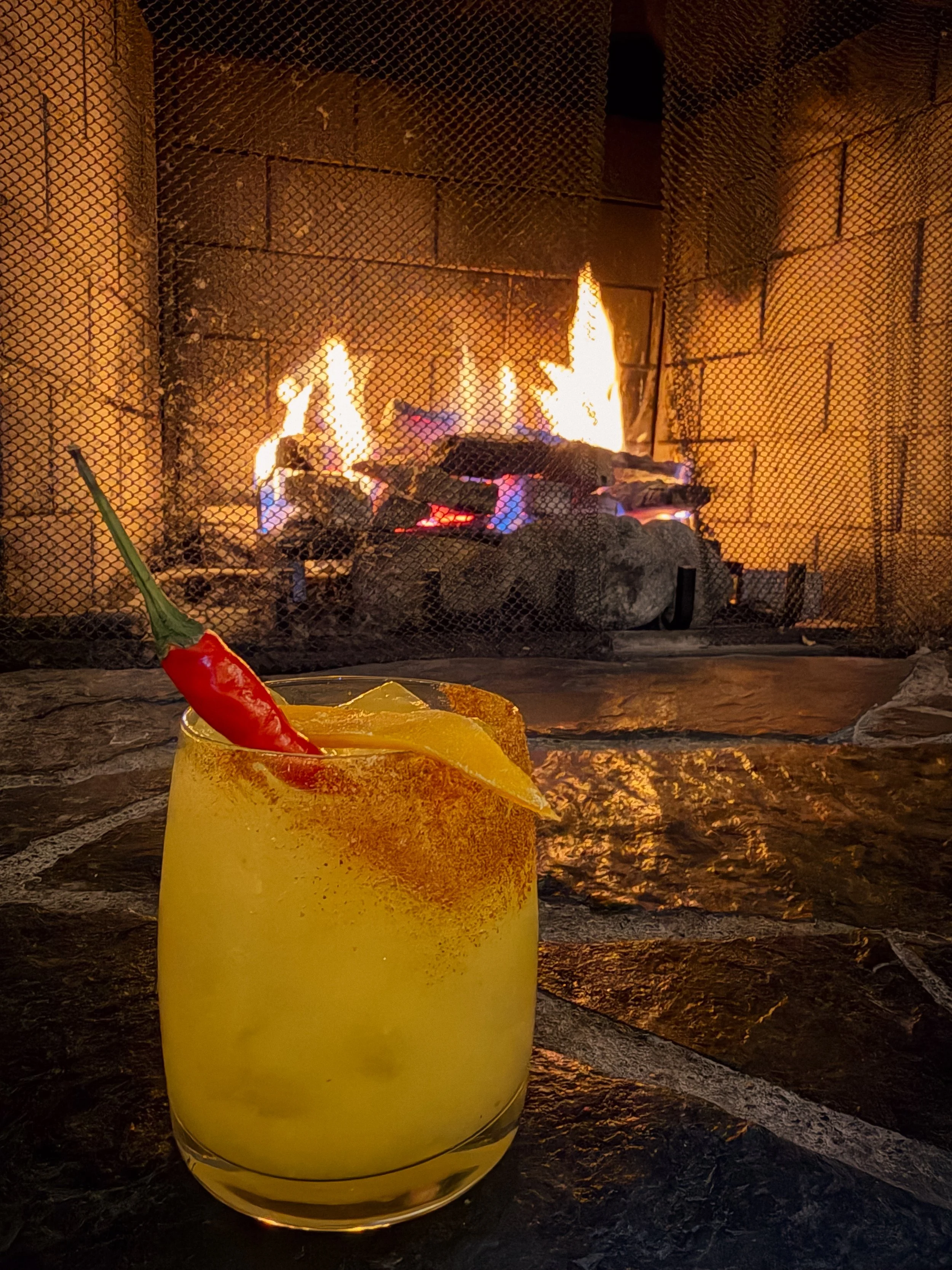 Winter Cocktail by Fireplace in Cozy Lounge.jpg